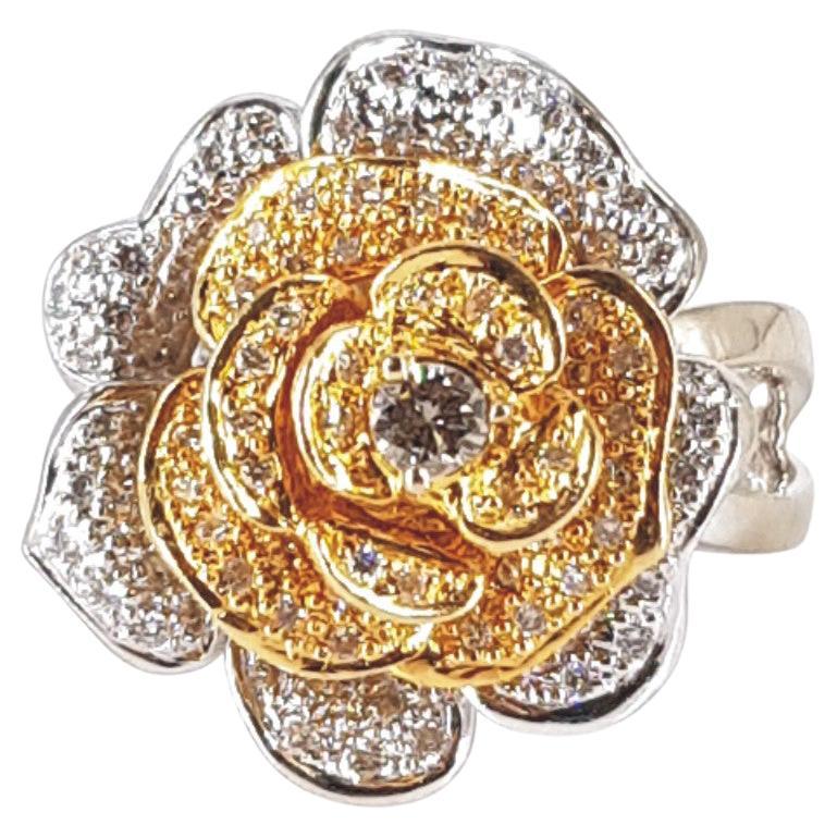Rosie with a splash of colour, this ring says it all. Set in 18ct White & Yellow Gold and weighing 10.5 grams, this ring features 1 Round Brilliant Cut Diamond (LM vs-si) weighing 0.10carat, and is surrounded by 94 Round Brilliant Cut Diamonds (GH