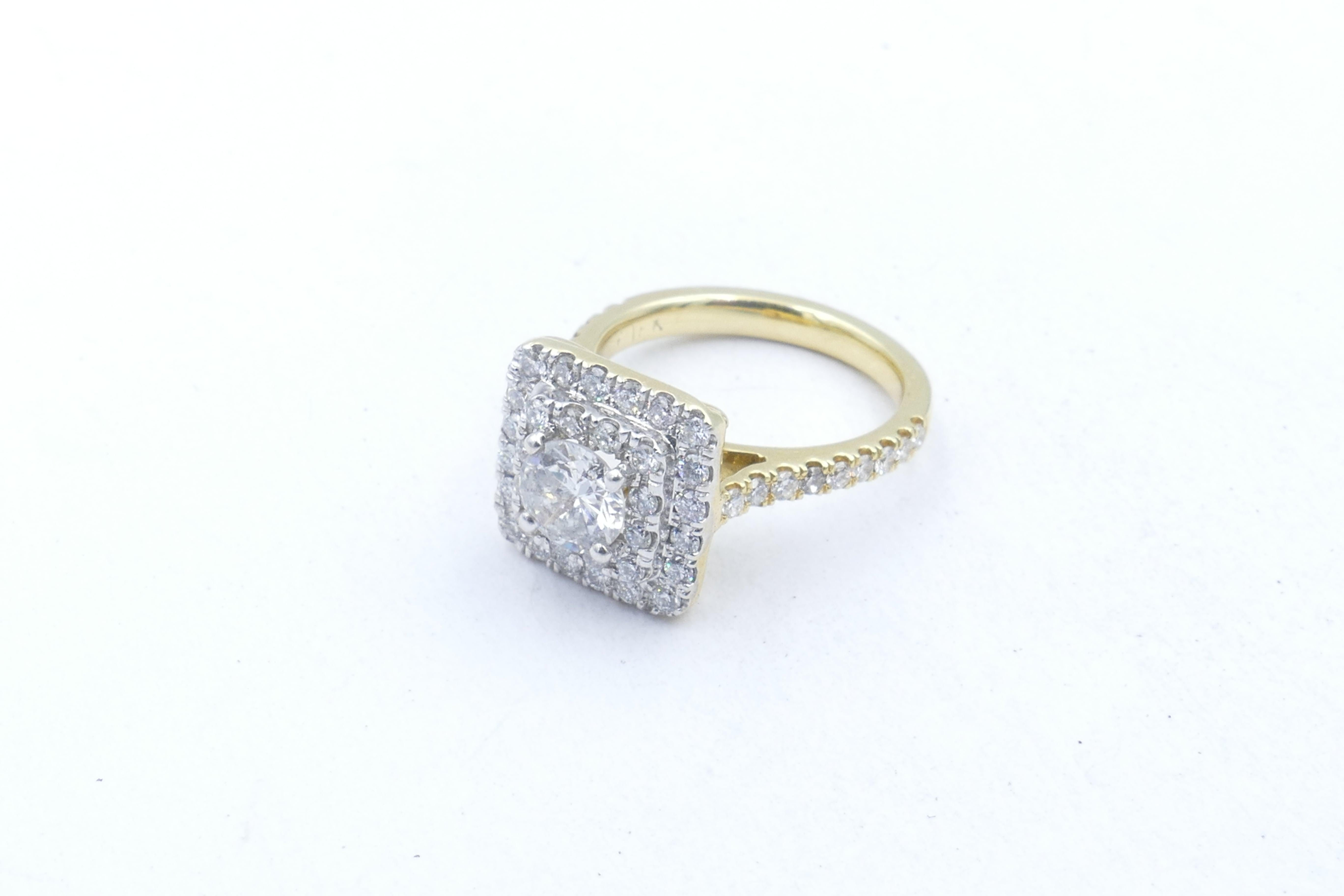 This beautiful high class Diamond Tablet Ring is colour G, clarity SI1, is 4 claw set, surrounded by 2 rows of 50 round brilliant cut Diamonds set in 18ct White Gold.
The Band is polished, low half round, upswept to a basket underrail, measuring