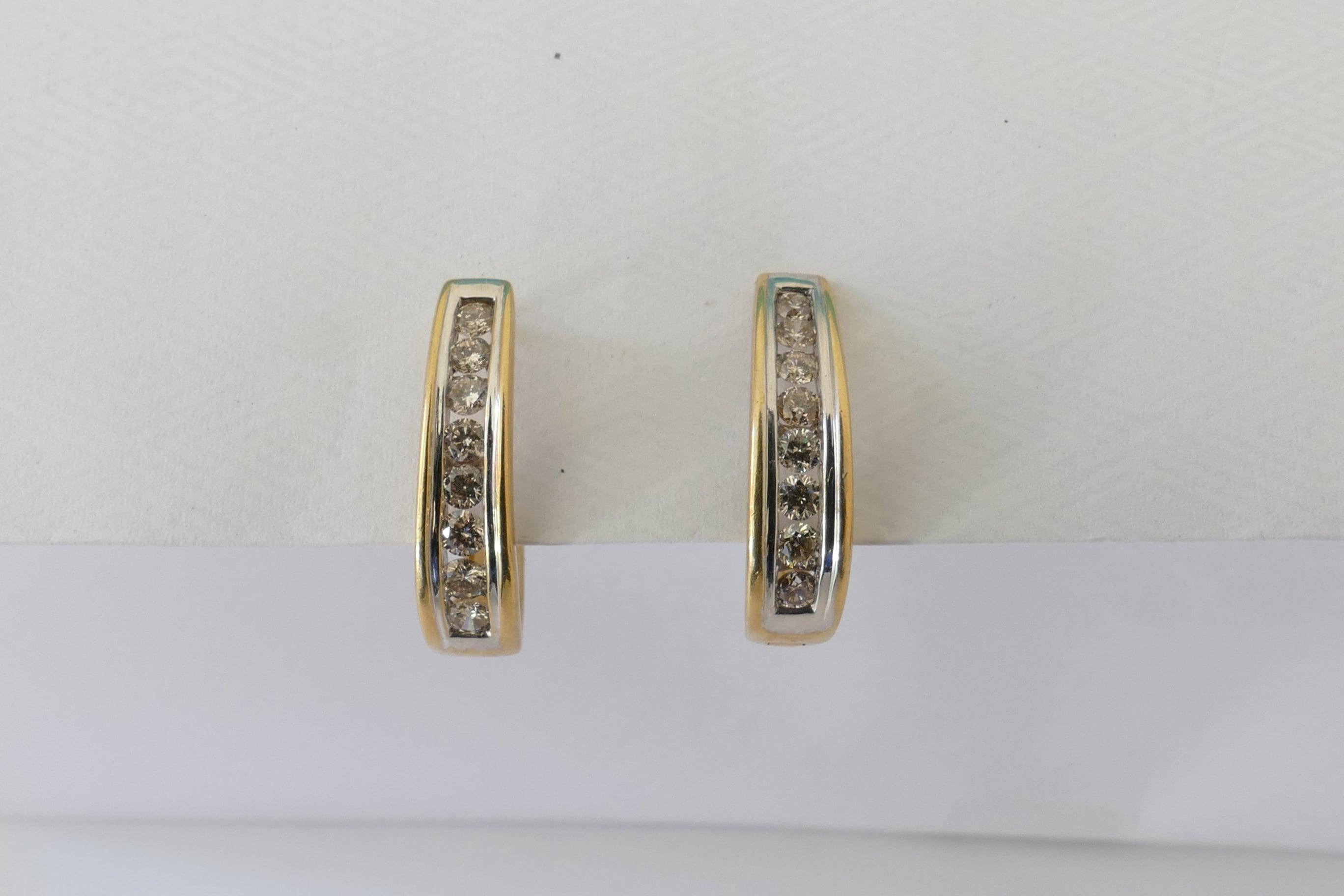 There are 16 Round Brilliant Cut Diamonds 2.59mm - 2.69mm Diameter Range weighing 1.01 carats, Colour J/K, Clarity SI2 to I-I, Channel Set in White Gold.
The Earrings measure 21mm X 4.37mm-5.45mm.
They feature lever Back Closures.
These Earrings are