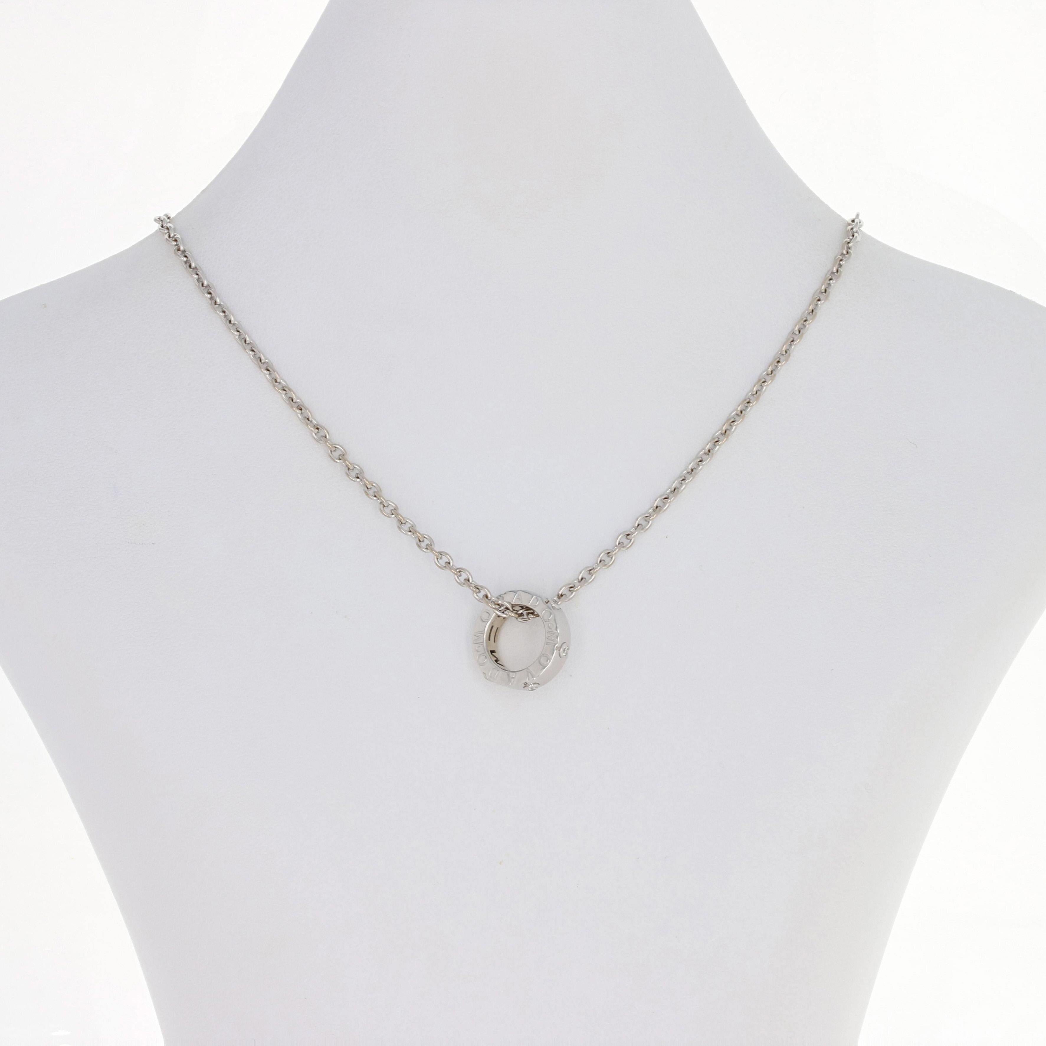 Add an extra touch of sparkle to your day with this beautiful necklace! Crafted by Movado in 18k white gold, this cable chain necklace elegantly showcases a signature Movado pendant accented by glistening diamonds.  

Metal Content: Guaranteed 18k