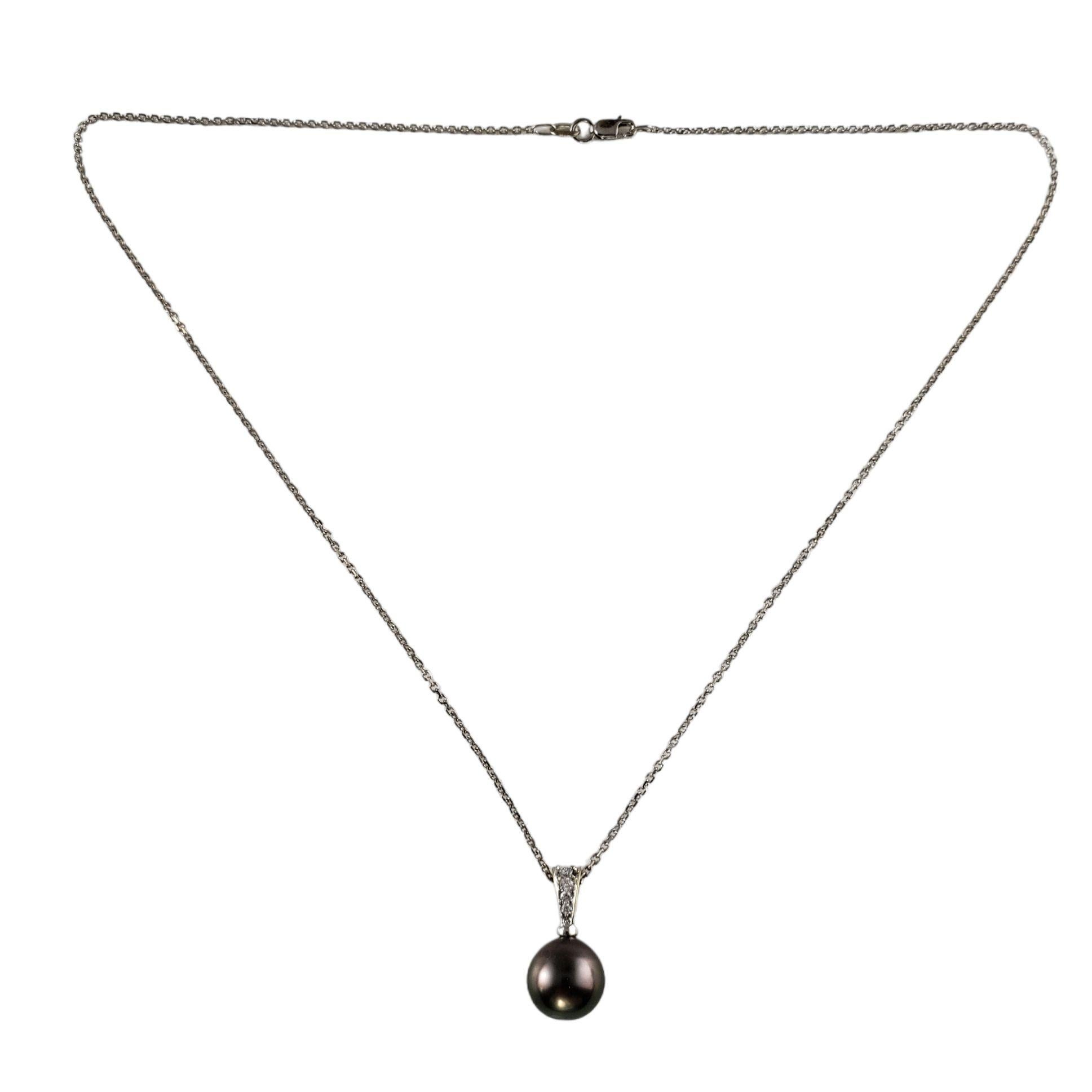 Vintage 18K/14K White Gold Black Pearl and Diamond Pendant Necklace-

This elegant 18K white gold pendant features one black pearl (10 mm) accented with four round brilliant cut diamonds. Suspends from a classic 14K white gold cable