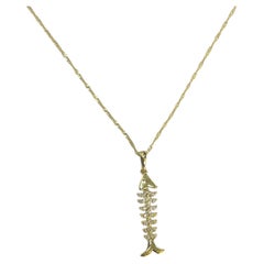 Colgante espina de pez con incrustaciones de diamantes en oro amarillo de 18k/14k