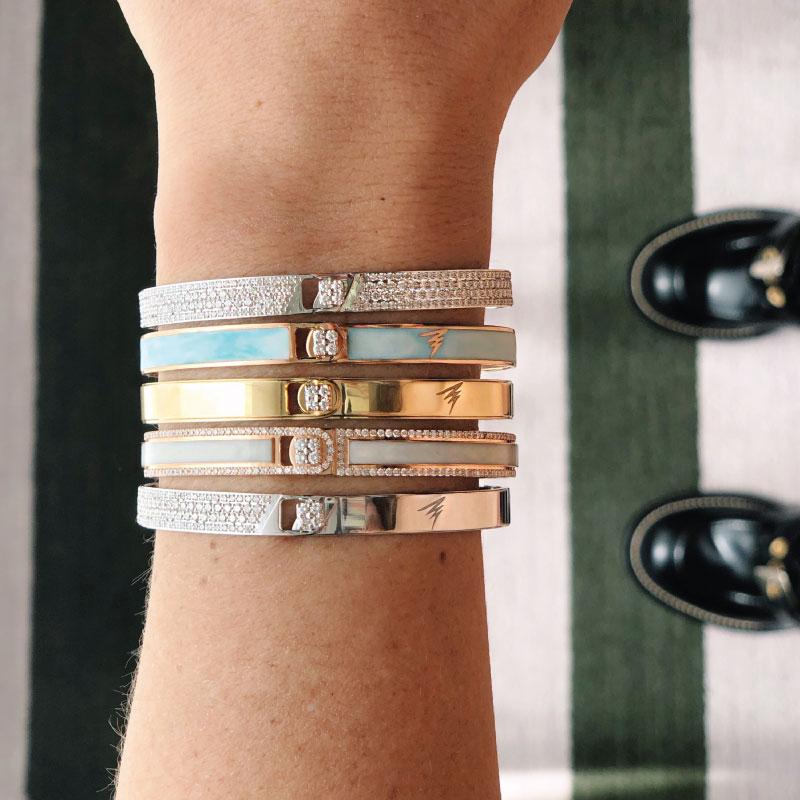 A ray of light, a band of colours, an illusion and journey on a wavelength. Iconic, bold and unique hand painted stackable designs. Add your personal touch to each design with your initials or a symbol.

Product Name: Light Grey Border Spectrum