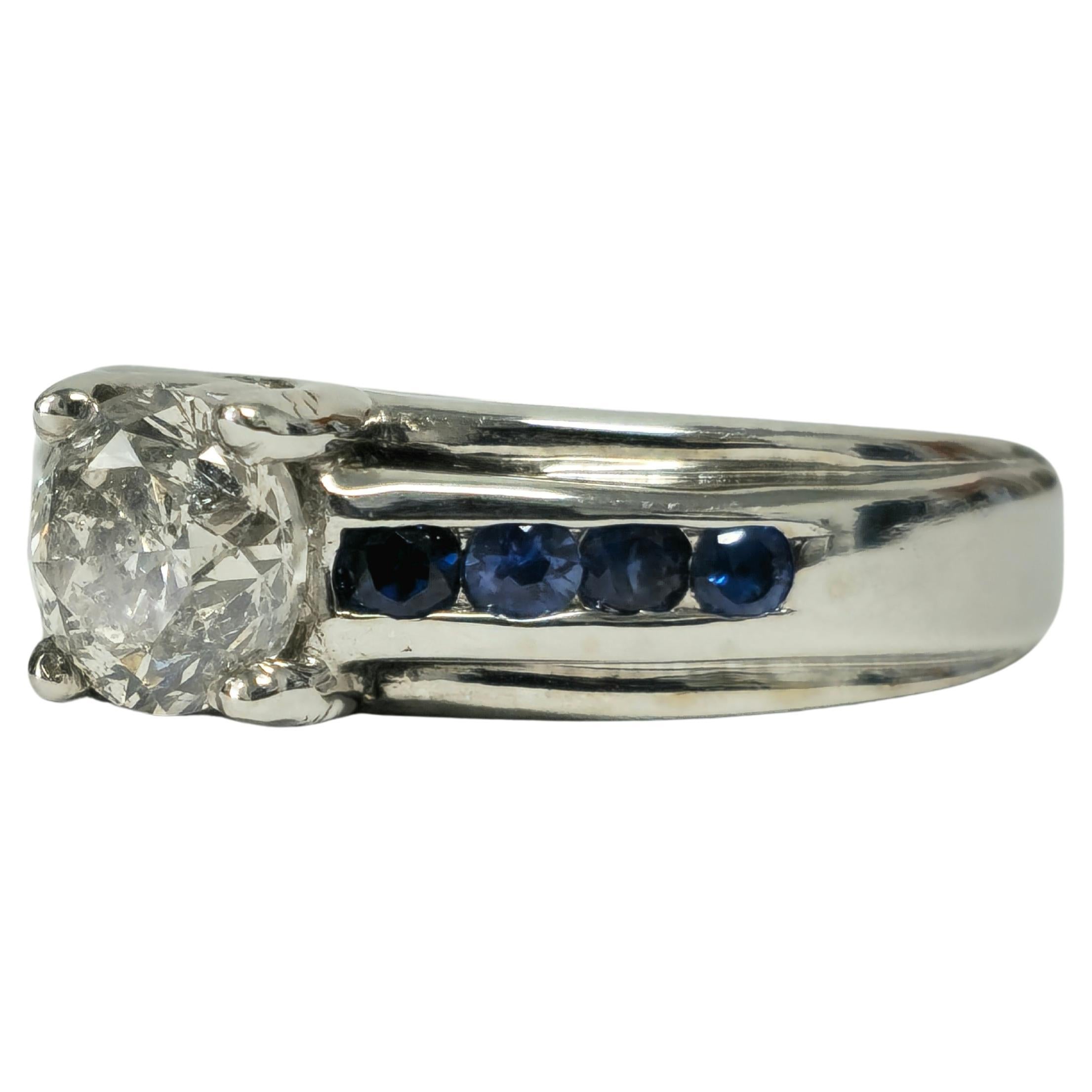 Indulge in elegance with this 18K white gold ring, boasting a total carat weight of 1.70. Featuring dazzling diamonds and captivating blue sapphires, it's perfect for birthdays, engagements, and special occasions.

Key Features:

Metal: 18K white