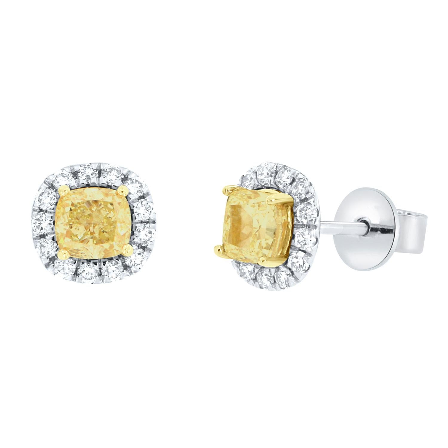 This 18k White gold and 22k yellow gold beautiful pair of halo earrings feature two Fancy Yellow cushion-shaped diamonds 1.40 Carat total weight encircled by one row of brilliant round diamonds.
The small white diamonds on the earrings are 0.33