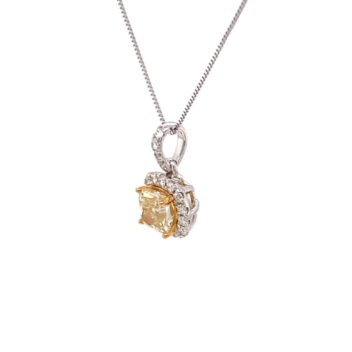 This stunning 18k White gold and 22k Yellow gold pendant feature a 1.57 Carat Yellow square cushion-shaped diamond encircled by a row of brilliant round diamonds on a 1 mm chain.
The chain can be either 18 inches or 16 inches long.
The small