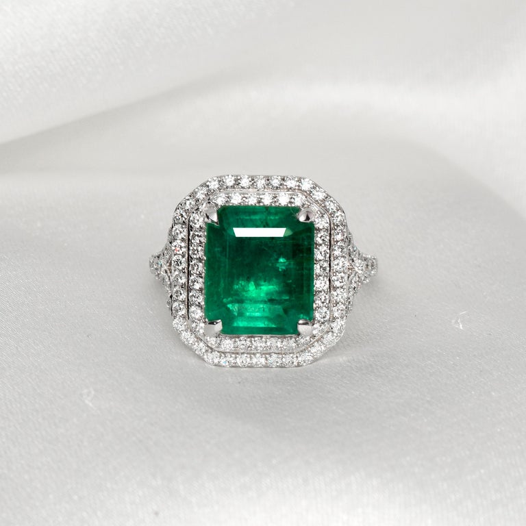 **One IGI-Certified 18K White Gold 4.01 Ct Emerald&Diamonds Engagement Ring** 

One top-quality, green, clean with great luster natural emerald as the center stone weighing 4.01 ct company surrounded by the FG VS accent diamonds weighing 0.83 ct not