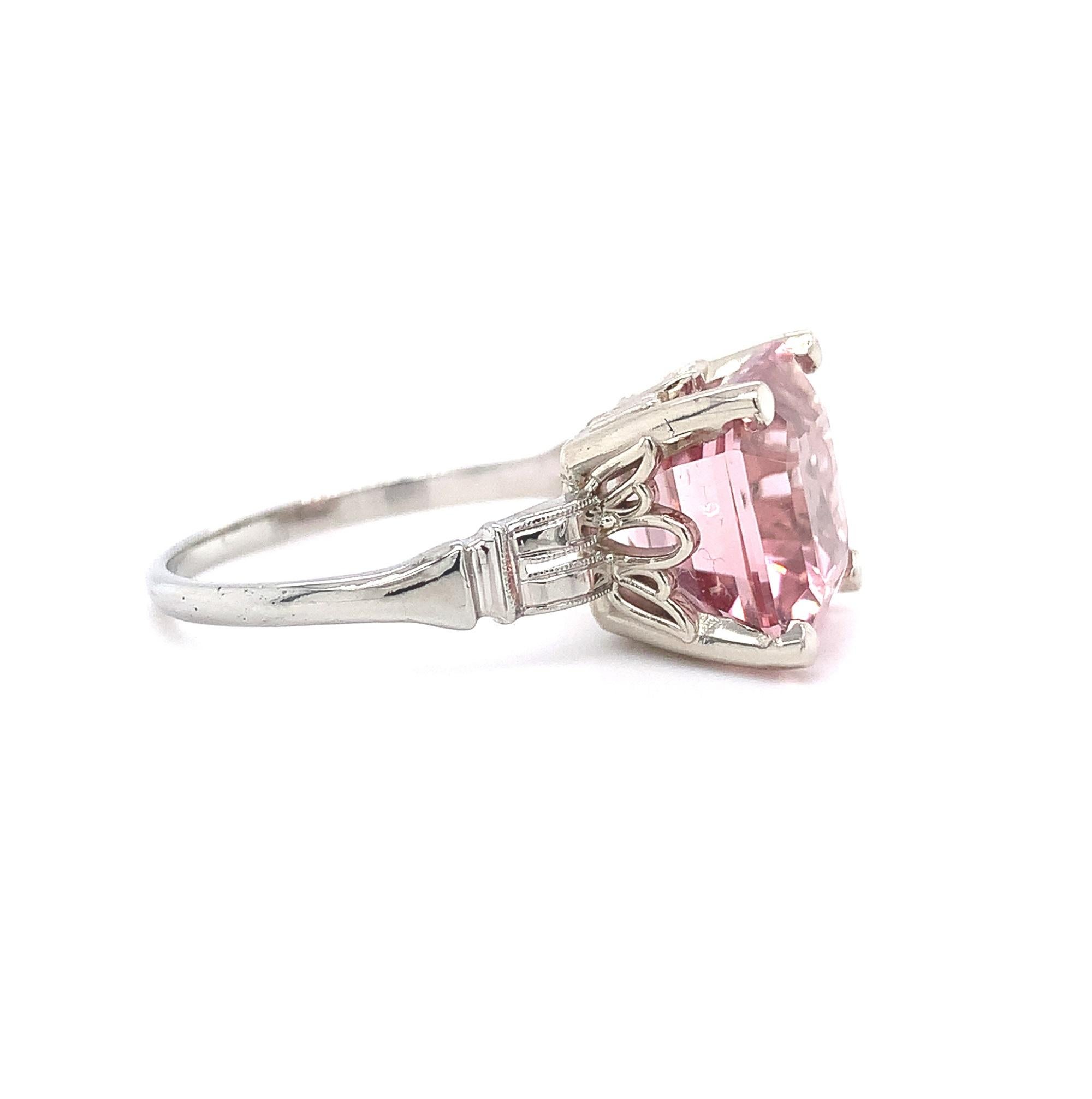 18K white gold  tourmaline and diamond ring featuring a square asscher cut tourmaline weighing 4.98 carats. The tourmaline has light pink color and fine clarity. It measures about 9.5 mm.  The ring fits a size 6 1/2 finger and weighs 2.55dwt. It