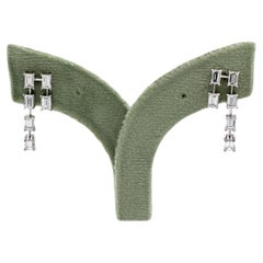 Boucles d
oreilles en or blanc 18K 750 diamants naturels taille émeraude