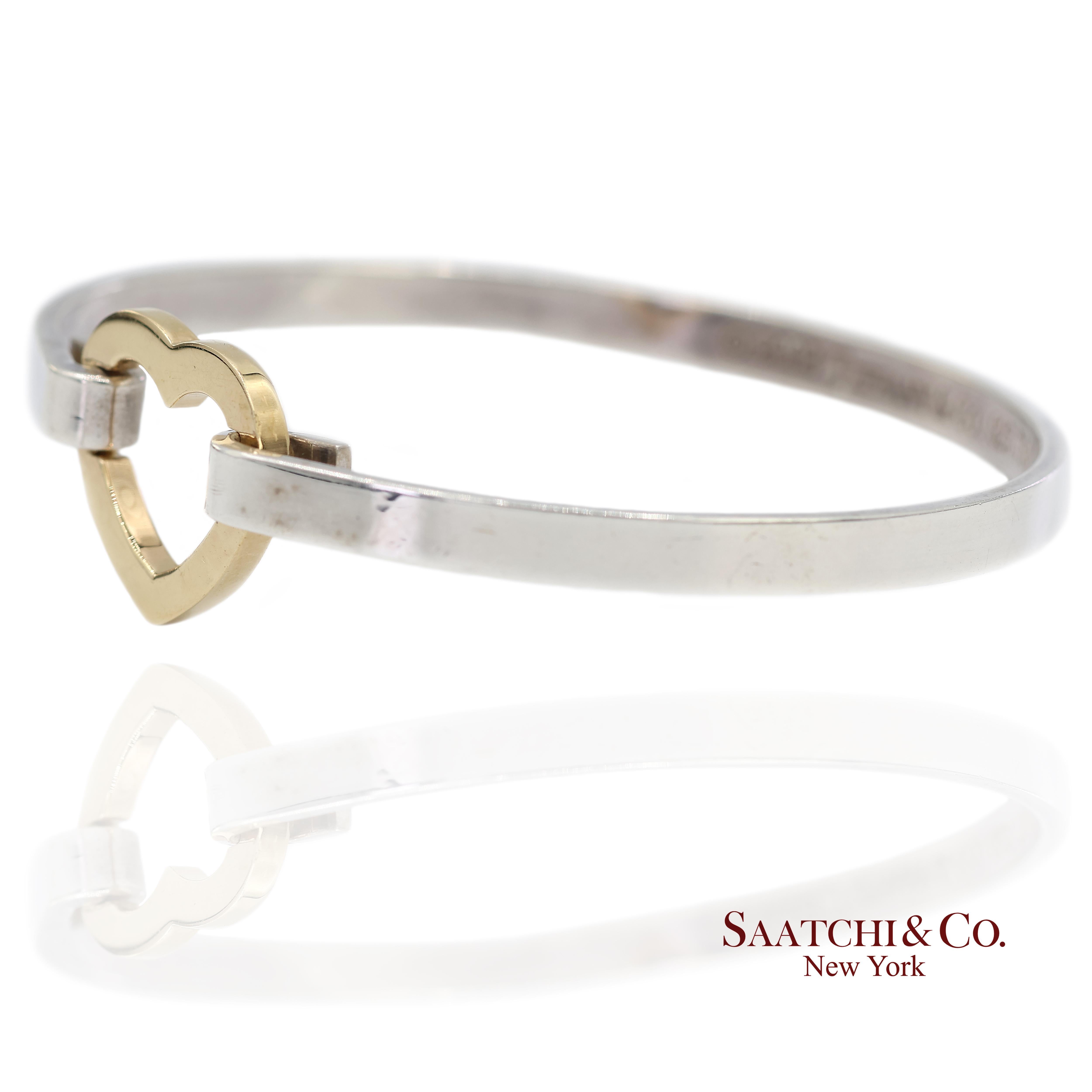 Bracciale a cuore in oro giallo 18k e argento sterling

Tipo di metallo: Oro giallo 18 carati e argento sterling
Peso totale dell'articolo: 15,2 grammi
Lunghezza: 18,5 mm
Larghezza: 16.0 mm
Altezza: 2.1 mm
Grande: No

Punzoni: © 2003 Tiffany & Co.