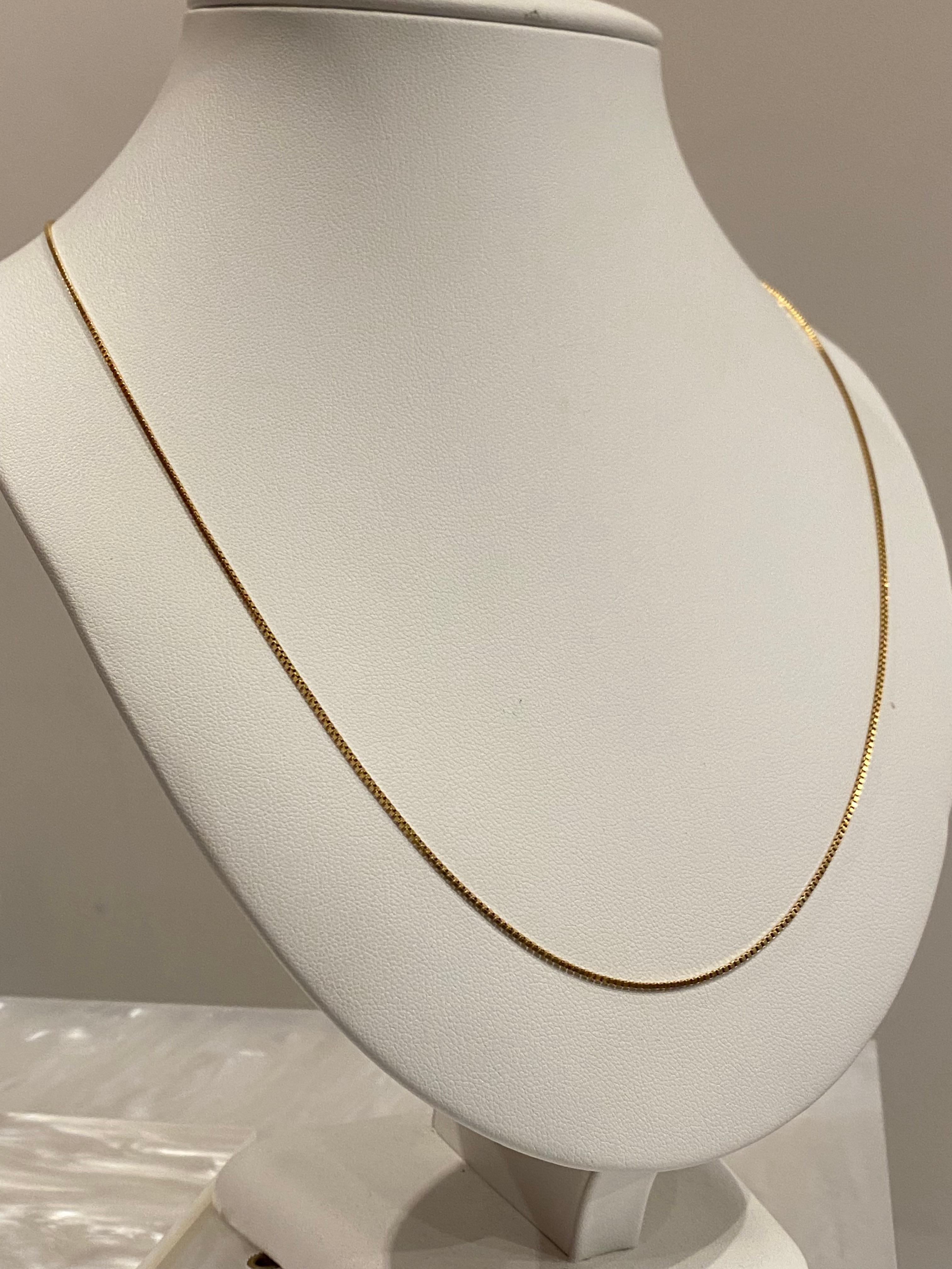 Chaîne à maillons en or jaune 18K 750, 
Fermoir à anneau à ressort, 
estampillé 18K, poinçon italien 

Longueur : 59.5cm - 23.4