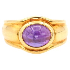 Anello con ametista naturale cabochon in oro giallo 18k 750