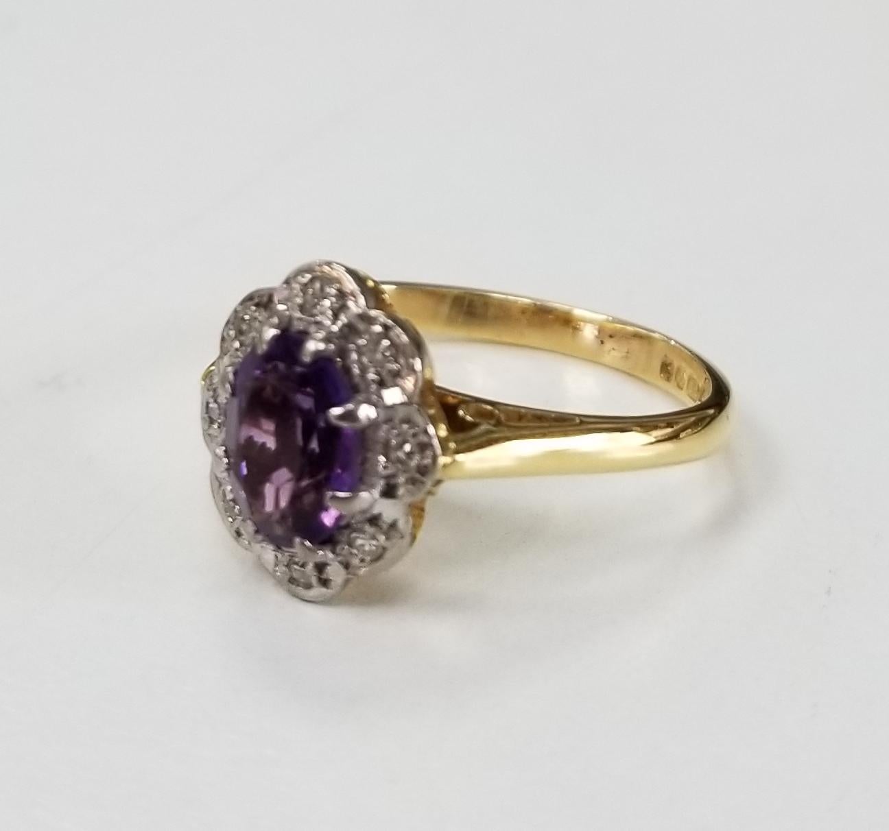 18k yellow gold amethyst and diamond ring, containing 1 oval cut amethyst weighing .80pts. and 8 single cut diamonds of very nice quality weighing .08pts. Hallmarks show the item was assayed in Birmingham.  This ring is a size 4.5 but we will size