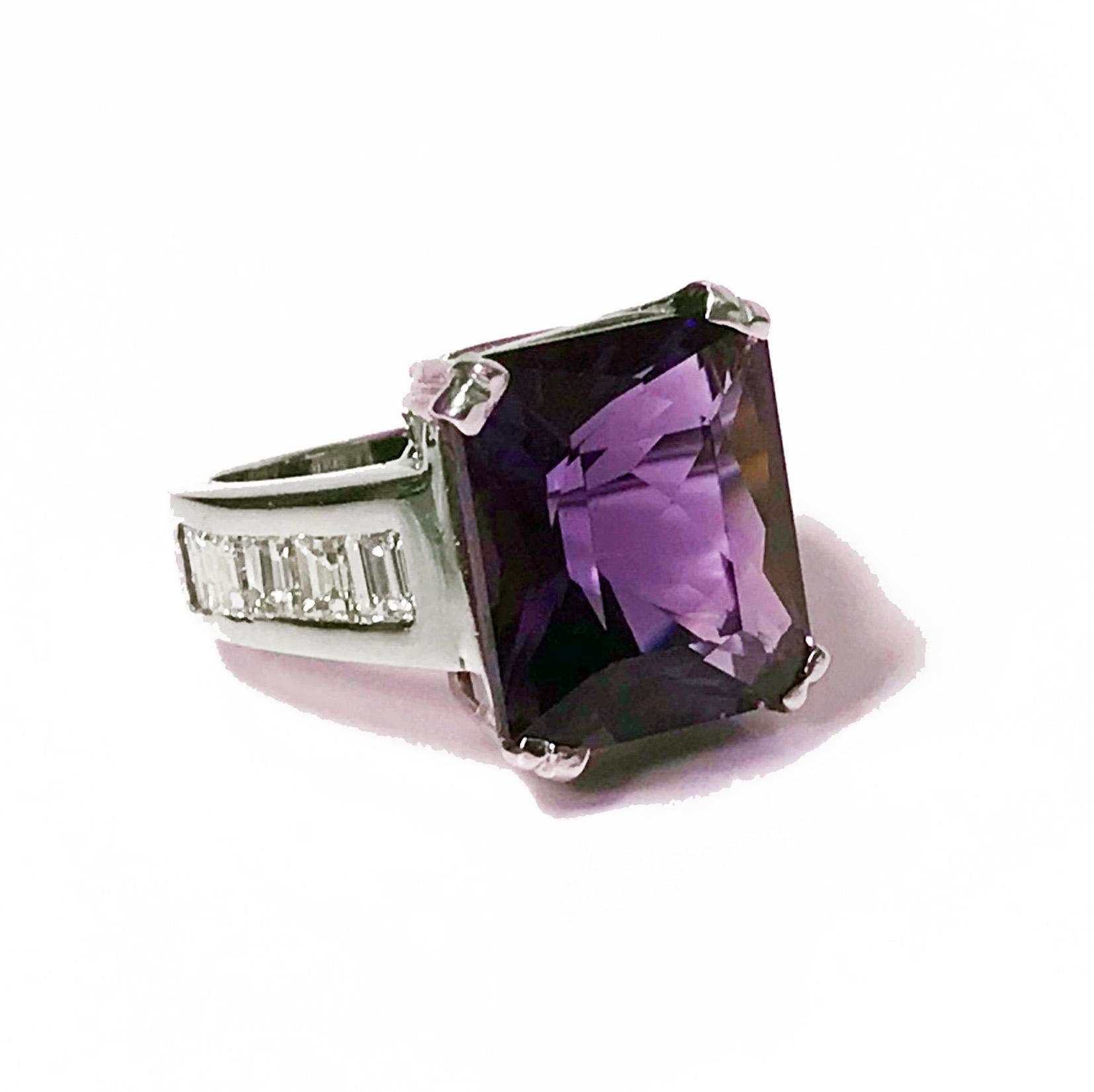18K Amethyst and Diamond Ring. The Ring basket claw set with a fine colour rectangular step cut Amethyst, gauging approximately 14.00 x 12.00 x 8.30 mm, approximately 9.65 cts, the shoulders channel set on either side with baguette cut diamonds, ten