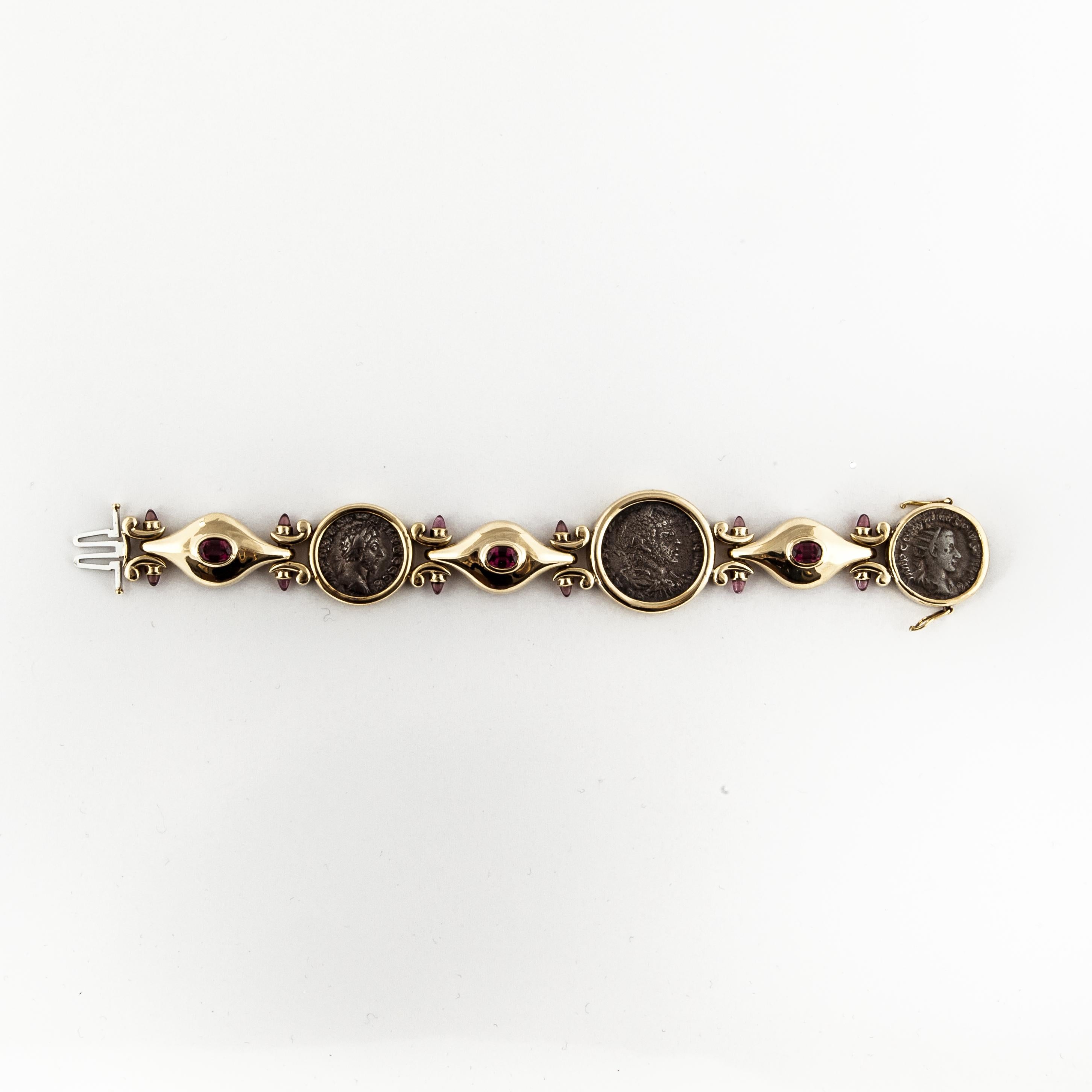 18K yellow gold bracelet featuring ancient Roman and Greek coins.  In addition, there are three oval faceted rubelites and 12 round cabochon rubelites.  The bracelet measures 7 1/2 inches long and 1 1/16 inches at the widest point.  Included are