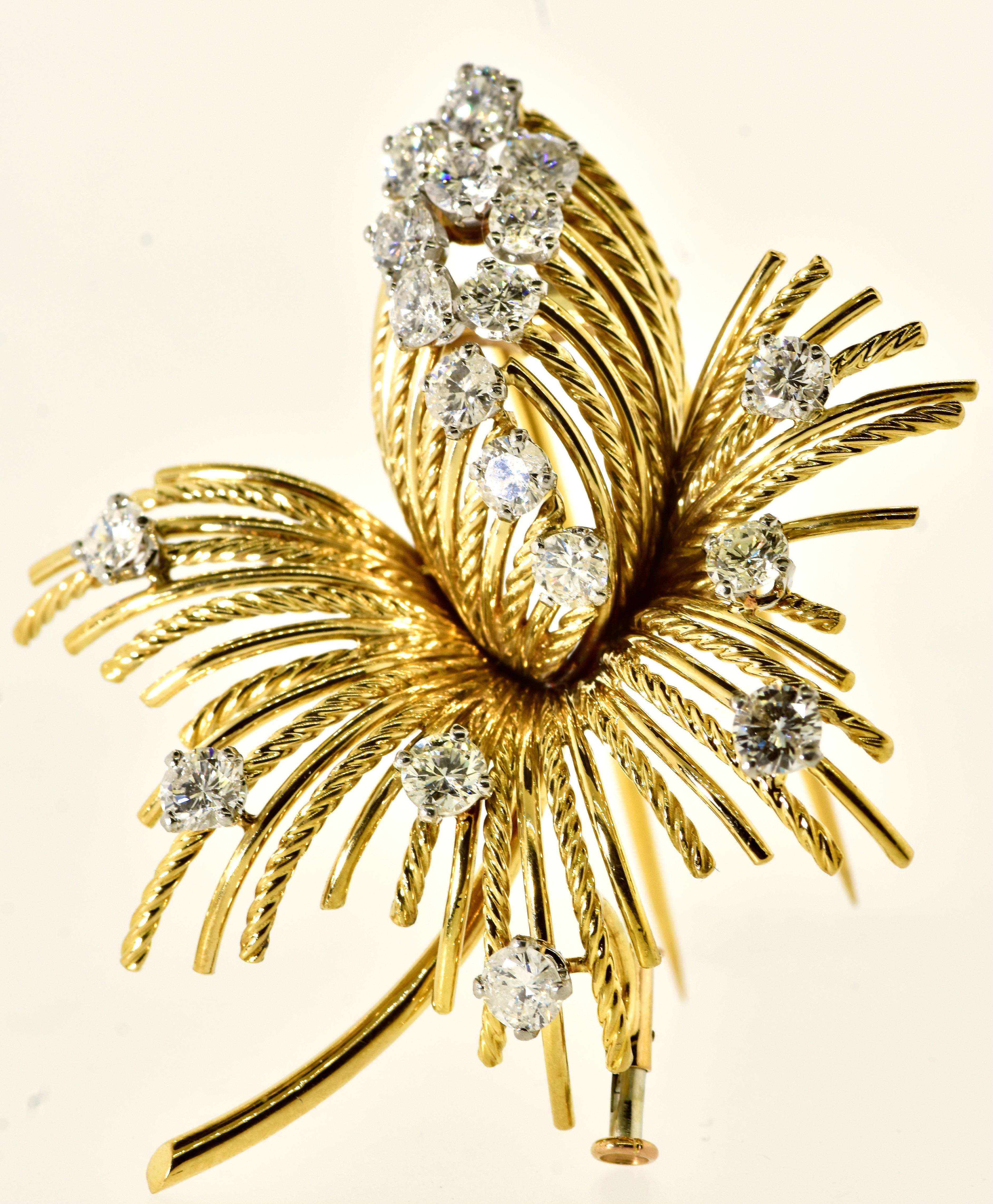 Diamond brooch made in Paris in the early '60's, possesses 18 fine white diamonds set in white prongs.  All well cut and finely matched the estimated diamond weight is 3.10 cts.  All the diamonds are slightly included and near colorless (H).

This