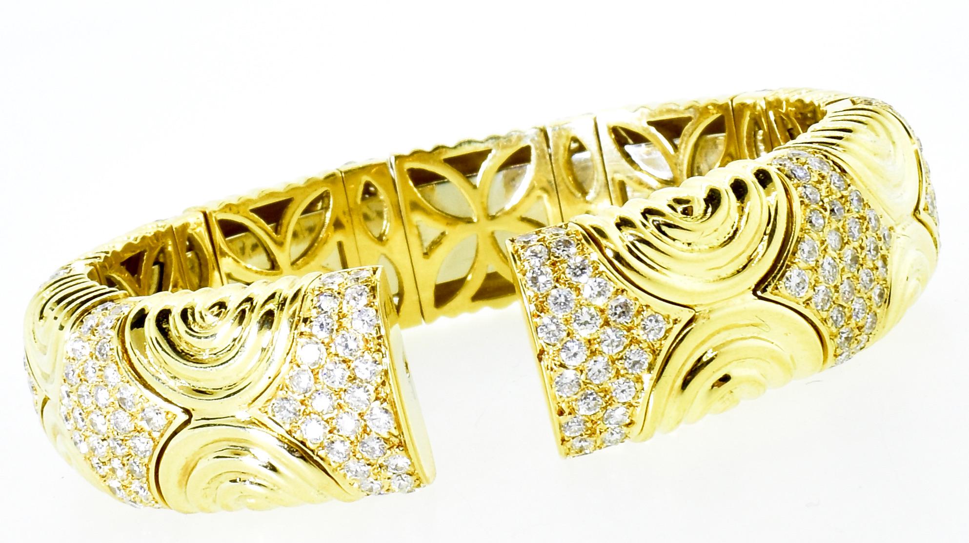 18K yellow gold bracelet possessing fine white brilliant cut diamonds.  The pave set diamonds are estimated to weigh 6.5 cts., all are near colorless (H), and very slightly included (VS).  The diamonds are well cut and well matched.  The bracelet