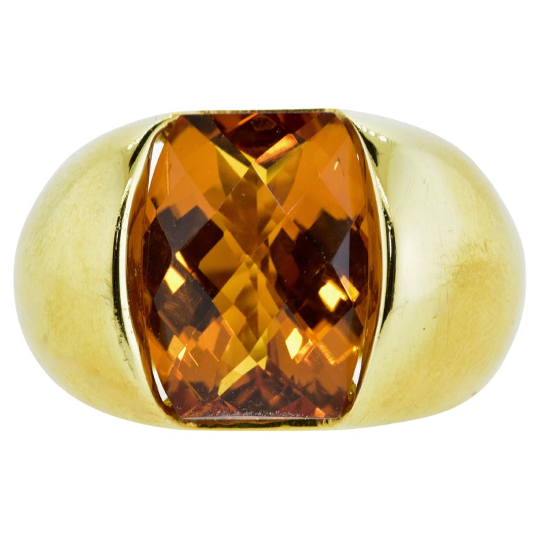 18K yellow gold hand made setting holds a fine fancy cut Madeira citrine of excellent quality.  This fancy cut stone weighs approximately 12 cts., the table is facetted to reflect the light well.  The natural Madeira Citrine is clean under