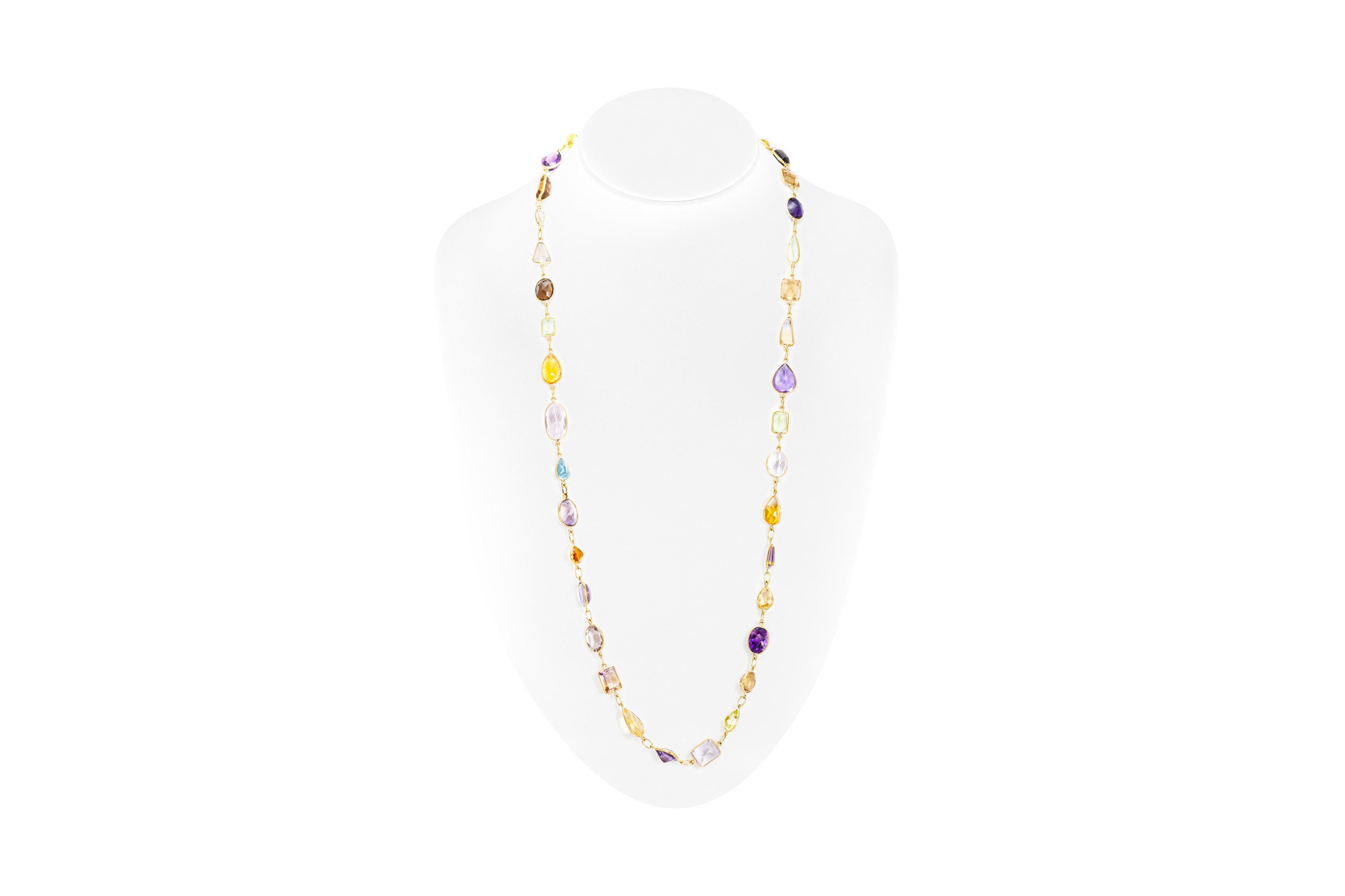 Beautiful multi colored tourmaline necklace is finely crafted in 18K yellow gold.
