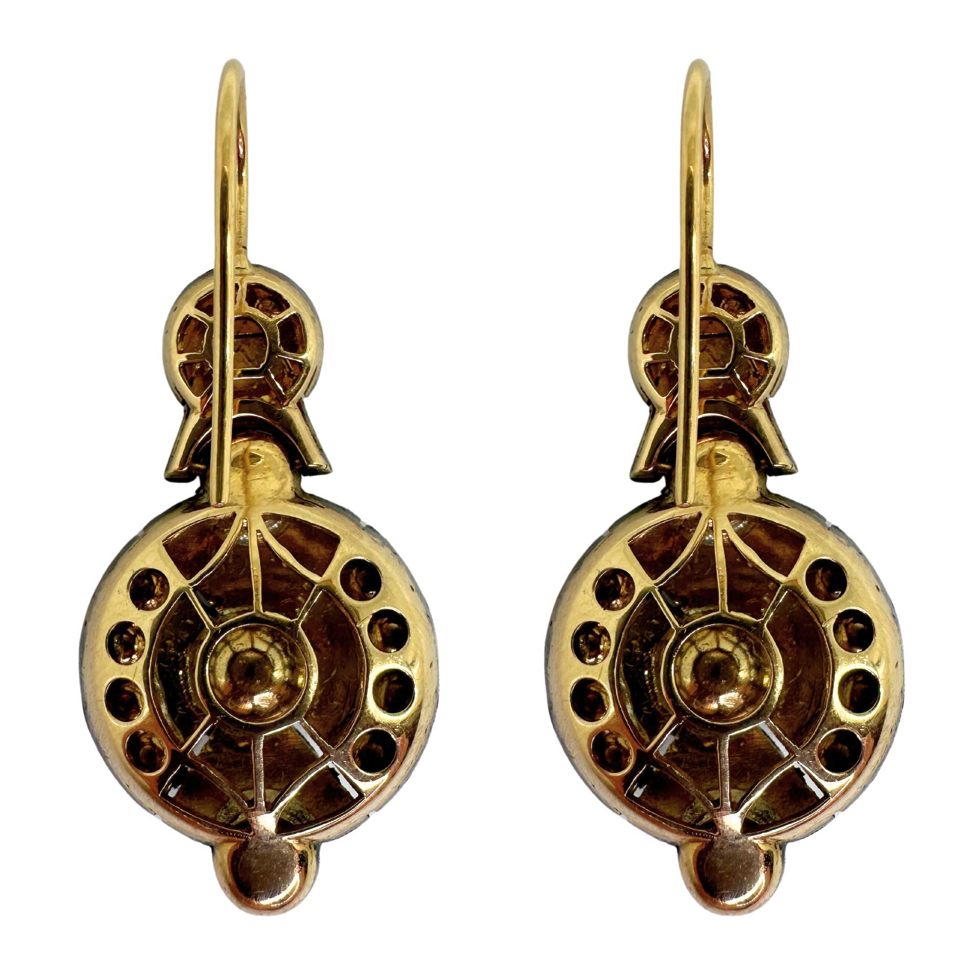 Elevate your style with these stunning 18k and Silver Rose Cut Diamond Earrings. In good condition with minor surface wear, these earrings are 1.75 inches in length and weigh 24.02 grams. Crafted with 18k yellow gold and silver, they feature 4.94