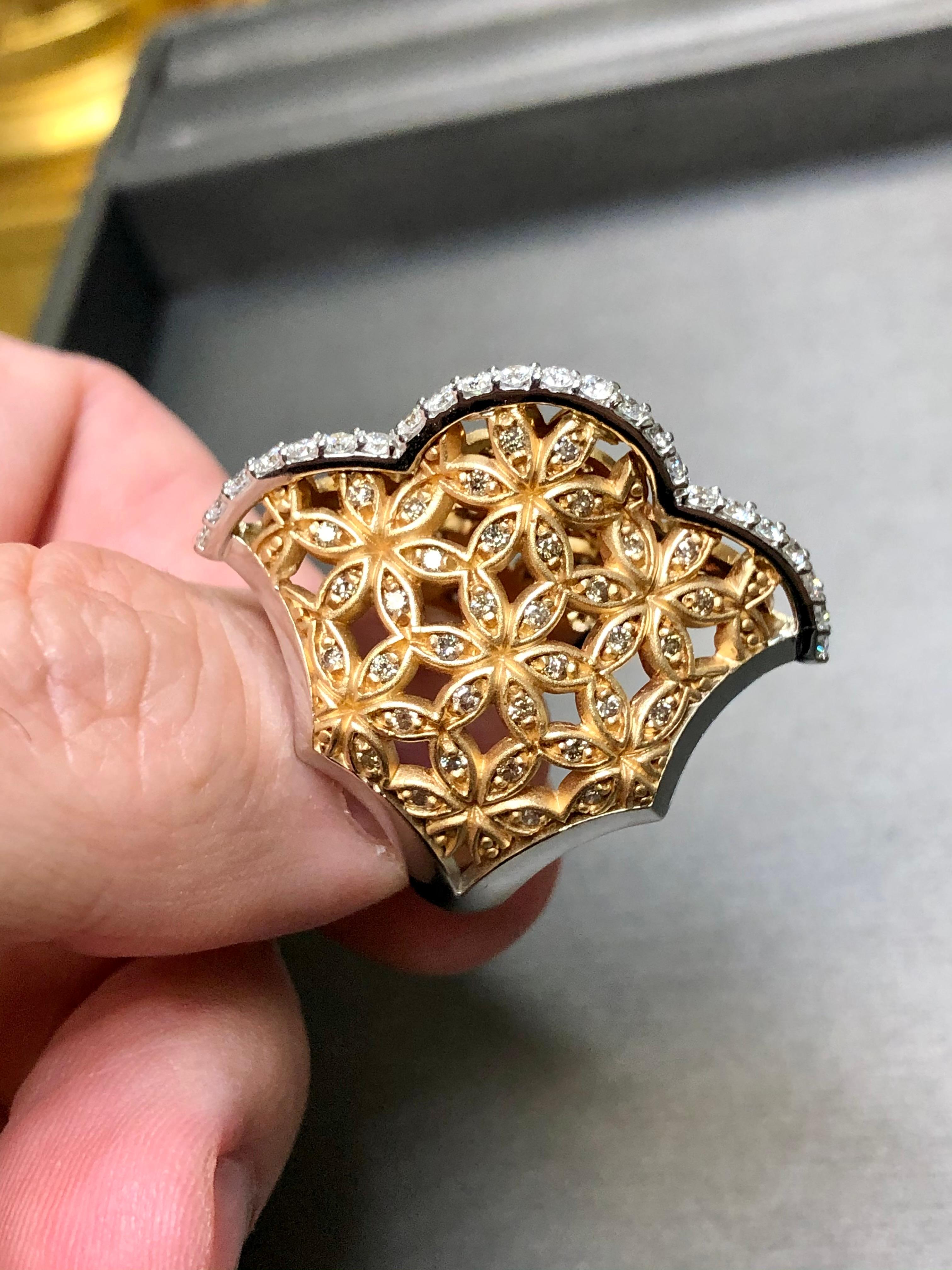 This gorgeously bold ring done by Turkish designer Armaggan has been crafted in 18K white a rose gold and set with approximately .46cttw in F-G color Vs1-2 clarity round diamonds as well as approximately .78cttw in fancy brown diamonds also being