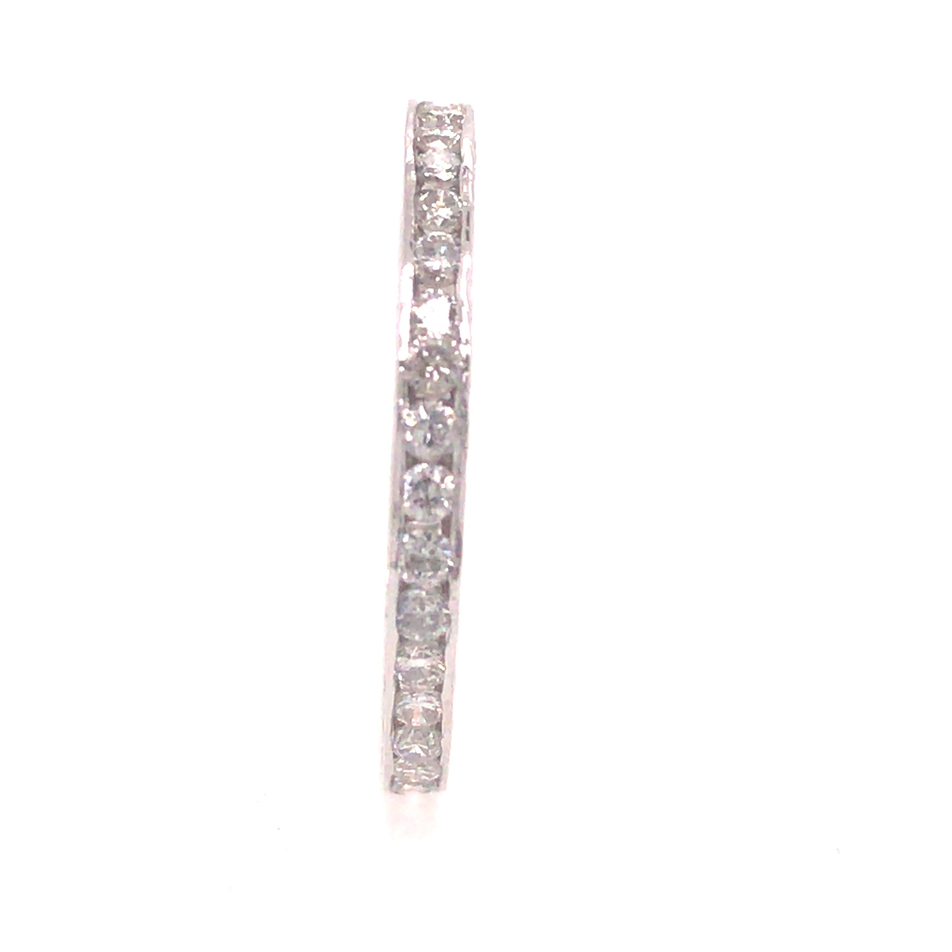 Art Deco Style Diamond Eternity Band in 18K White Gold.  Round Brilliant Cut Diamonds weighing .36 carat total weight, G-H in color and VS-SI in clarity.  The ring measures 1/16 inch in width.  Ring size 5 1/2.  .77 grams.