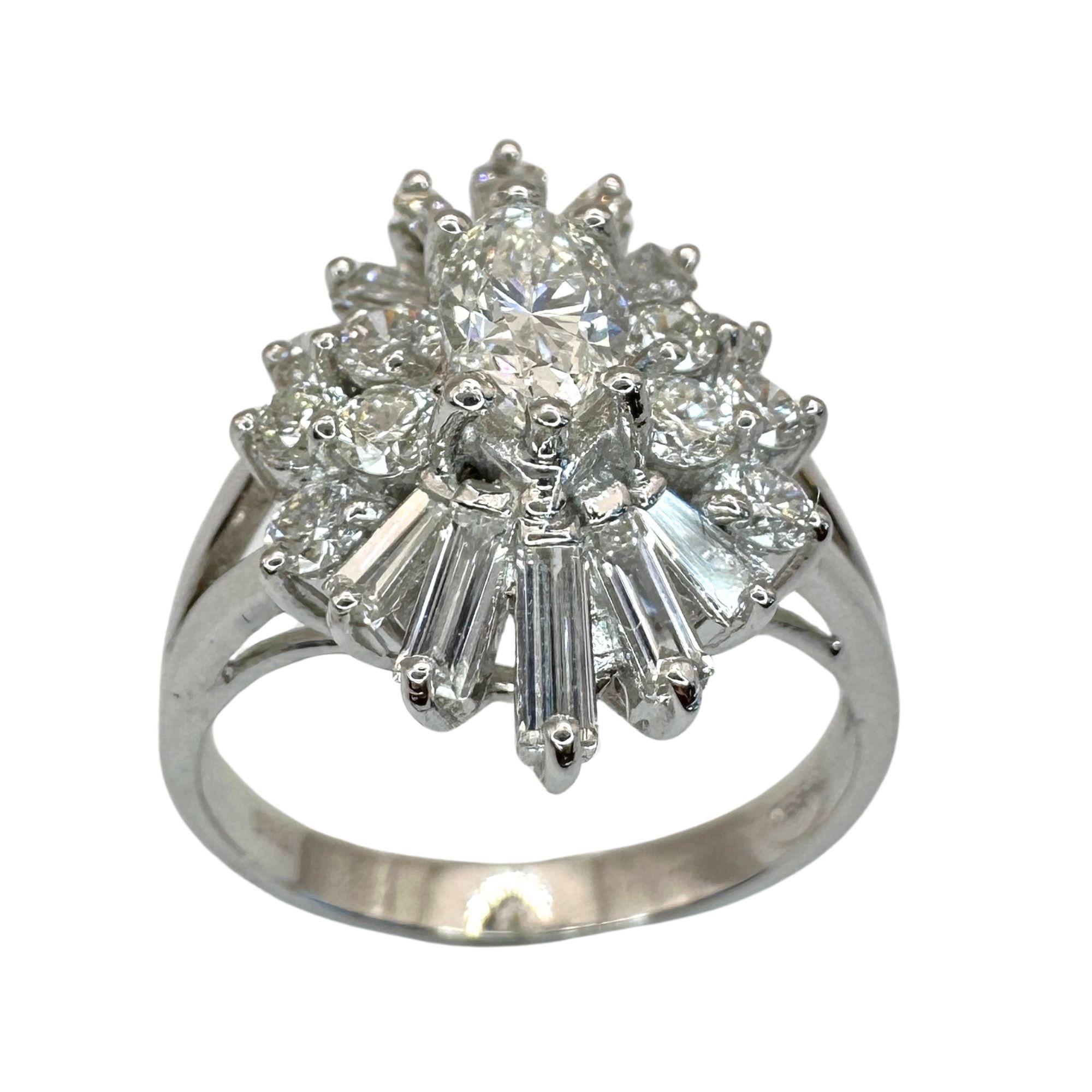 Crafted from luxurious 18k white gold, this stunning ring boasts a 6.25 size. Adorned with a sparkling 0.48 carat Marquise Cut diamond center and 0.95 carats of diamond accents, this piece is a true beauty. Weighing in at 4.79 grams, this ring is