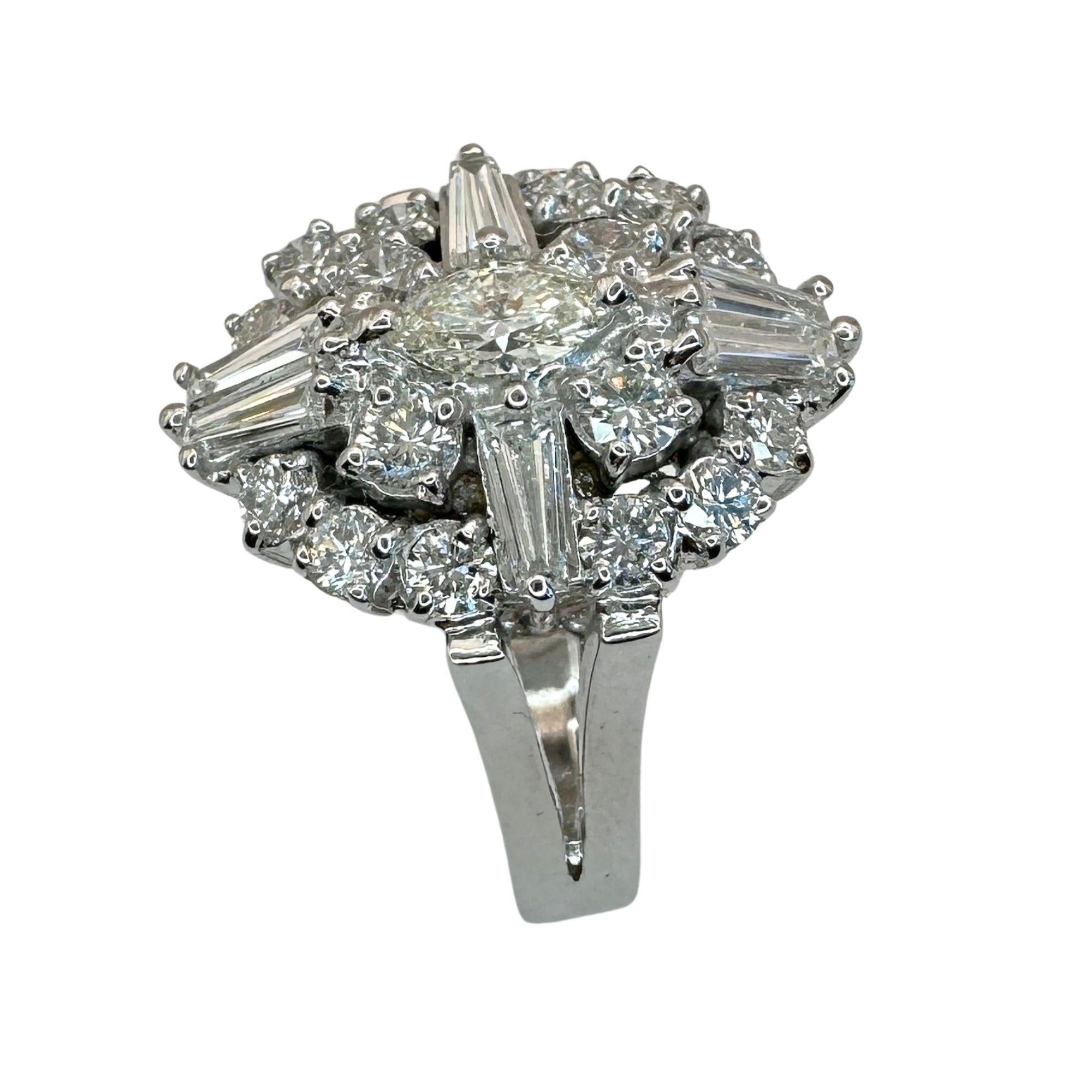 Indulge in luxury with this stunning 18k Baguette and Marquise Cut Diamond Ring. Crafted from 18k white gold, this exclusive piece features 1.55 carats of dazzling diamonds in a unique combination of cuts. In excellent condition with a weight of