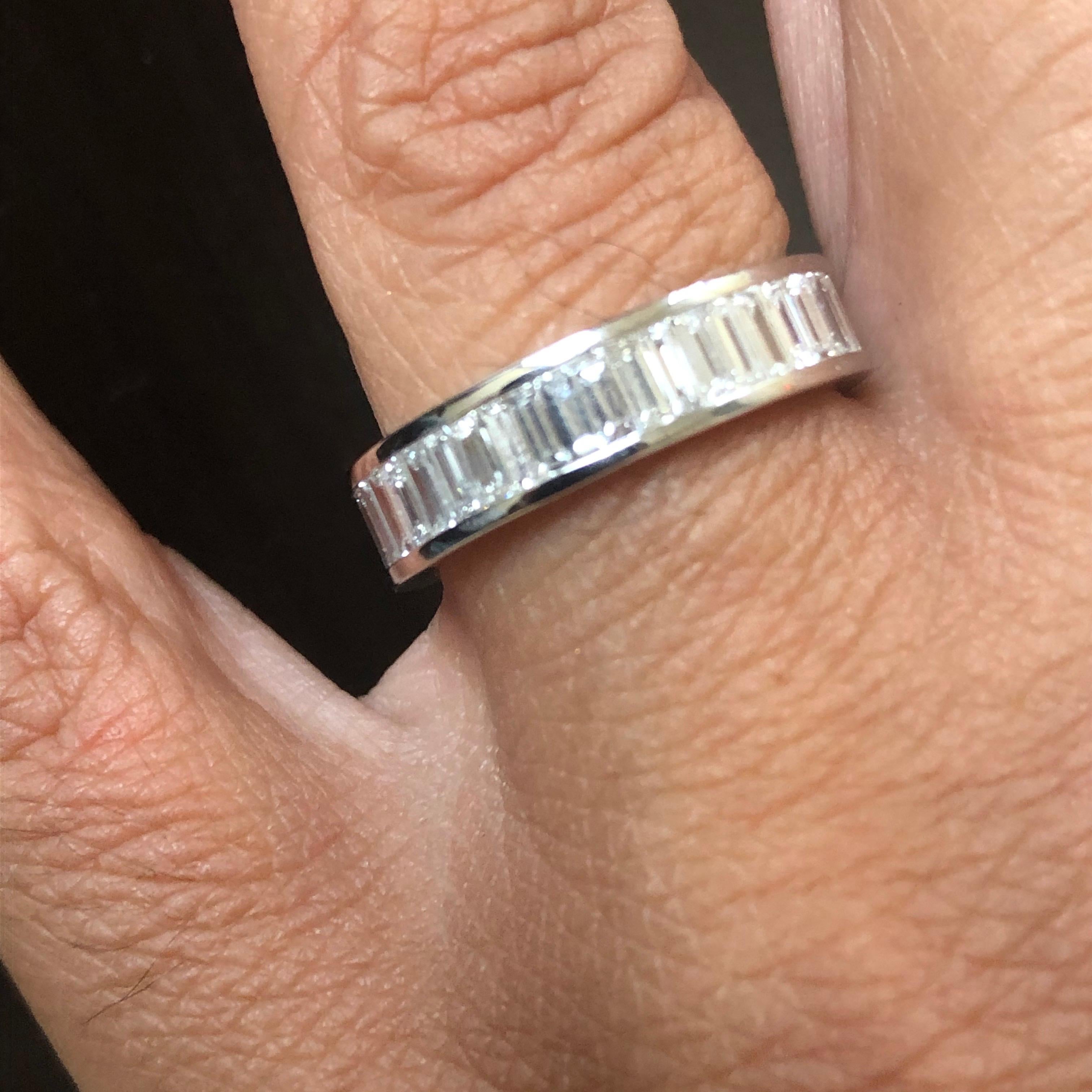 Baguette diamond eternity ring set in 18K white gold. The stones are set in a channel set. The total diamond weight of the ring is 2.20 carats. The color of the stones are F, the clarity is VVS1-VVS2. The ring is a size 6.5.