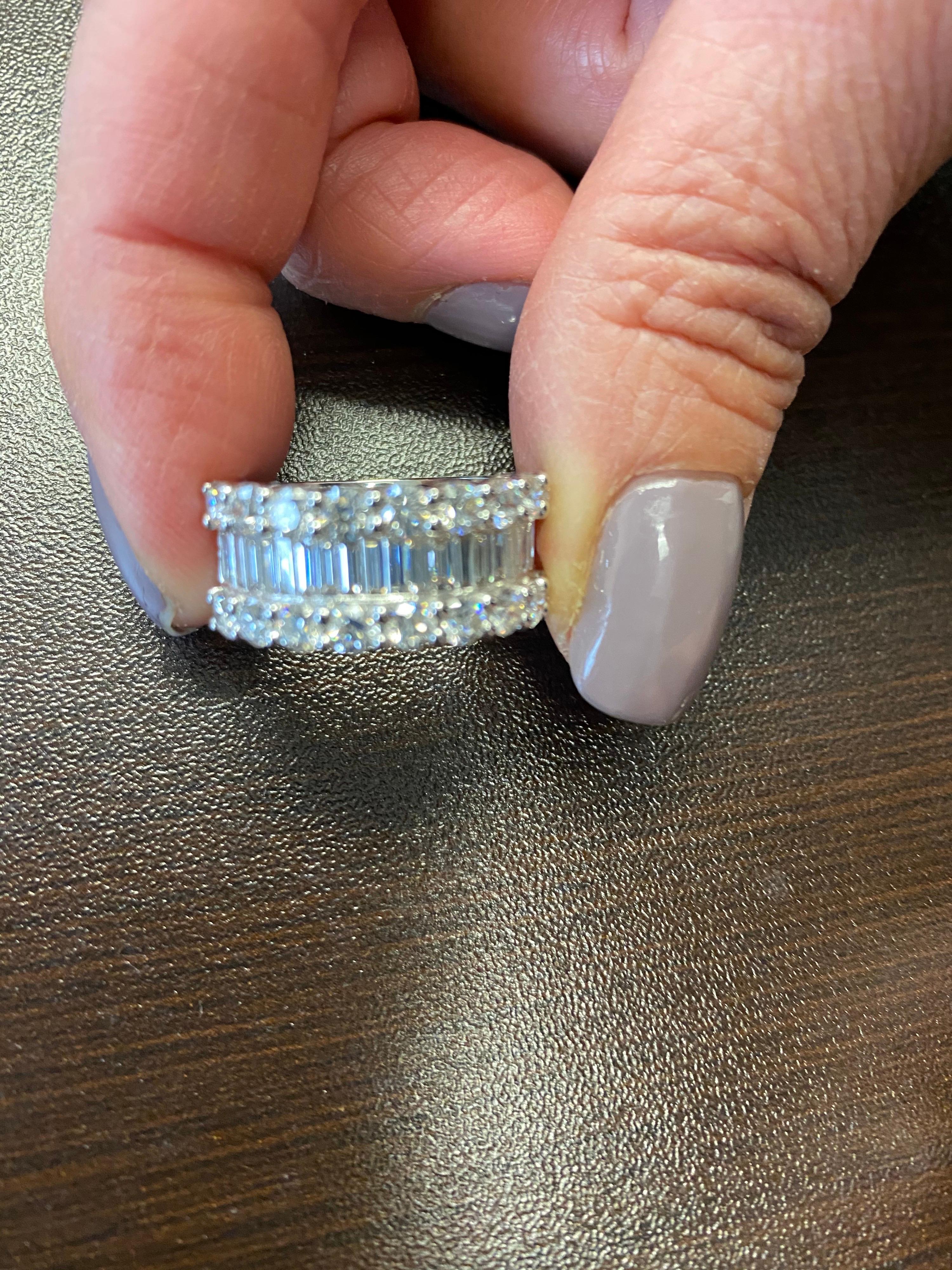 Halfway Baguette and Round diamond ring set in an illusion to create the look of emerald cut stones. The total weight of the ring is 3.52 carats. The color of the stones are F, the clarity is VS1. The size of the ring is 7.