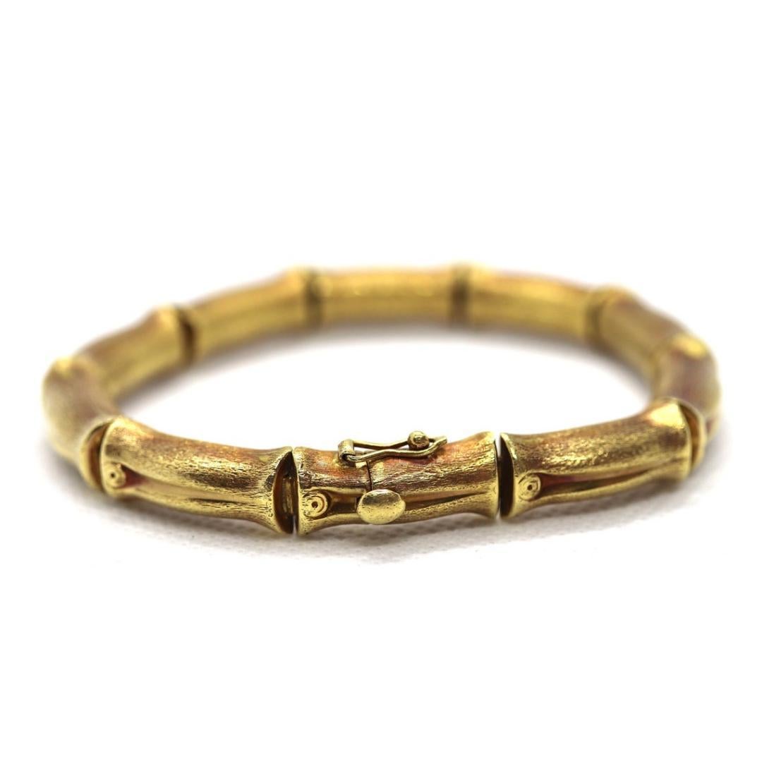 Vintage from the 1960s
Materials: Gold
Closure: Slide lock

Bracelet width: 9 Millimeters; Bracelet length: 8.25 Inches

Vintage 18K yellow gold elegant high fashion bamboo link bracelet. This fashionable piece of jewelry is crafted in gorgeous rich
