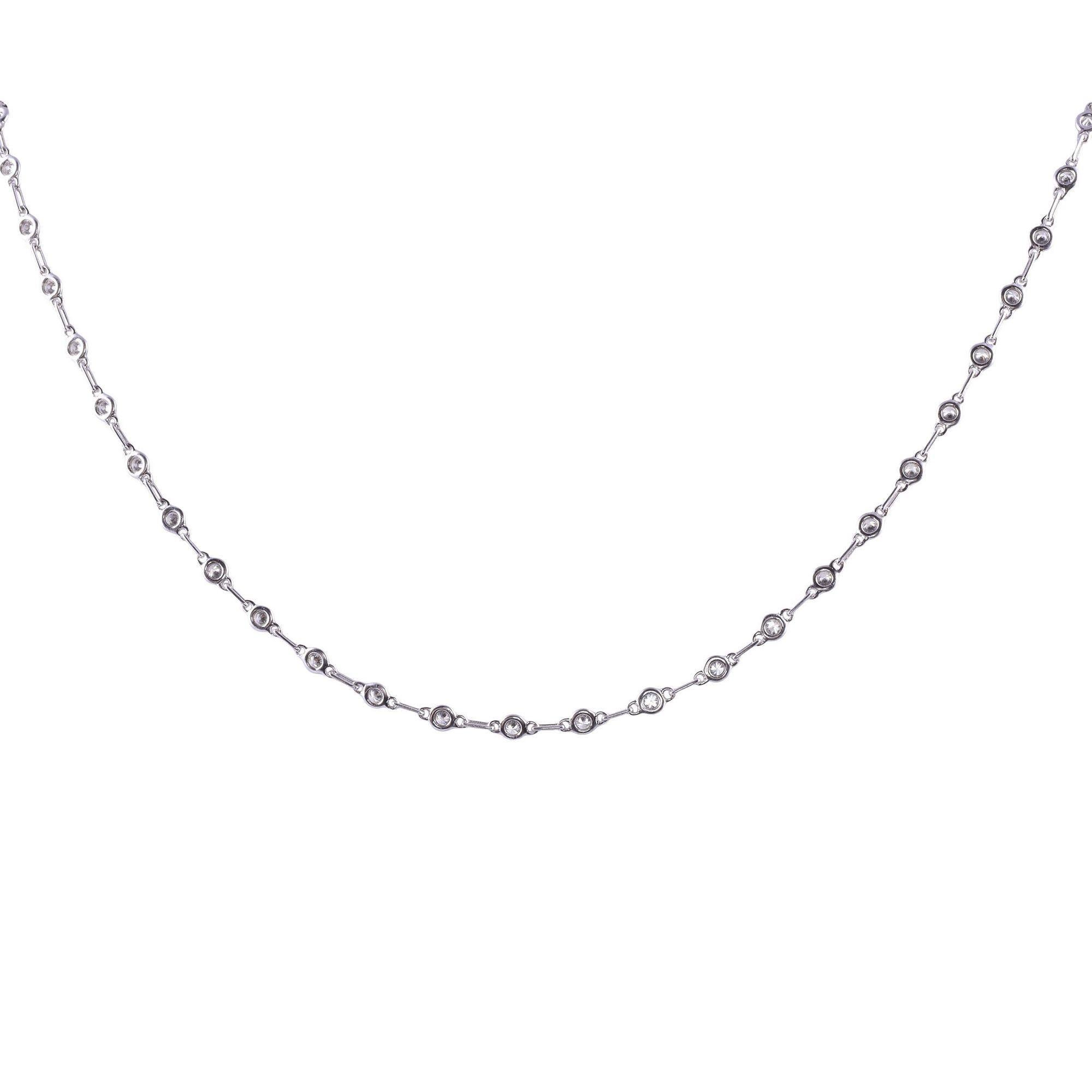 Estate 18K bezel diamond necklace. This estate diamond necklace is crafted in 18 karat gold and features 51 full cut diamonds at 2.40 carat total weight. The diamonds have VS1-2 clarity, with a few SI, and G-H color. This diamond necklace is in