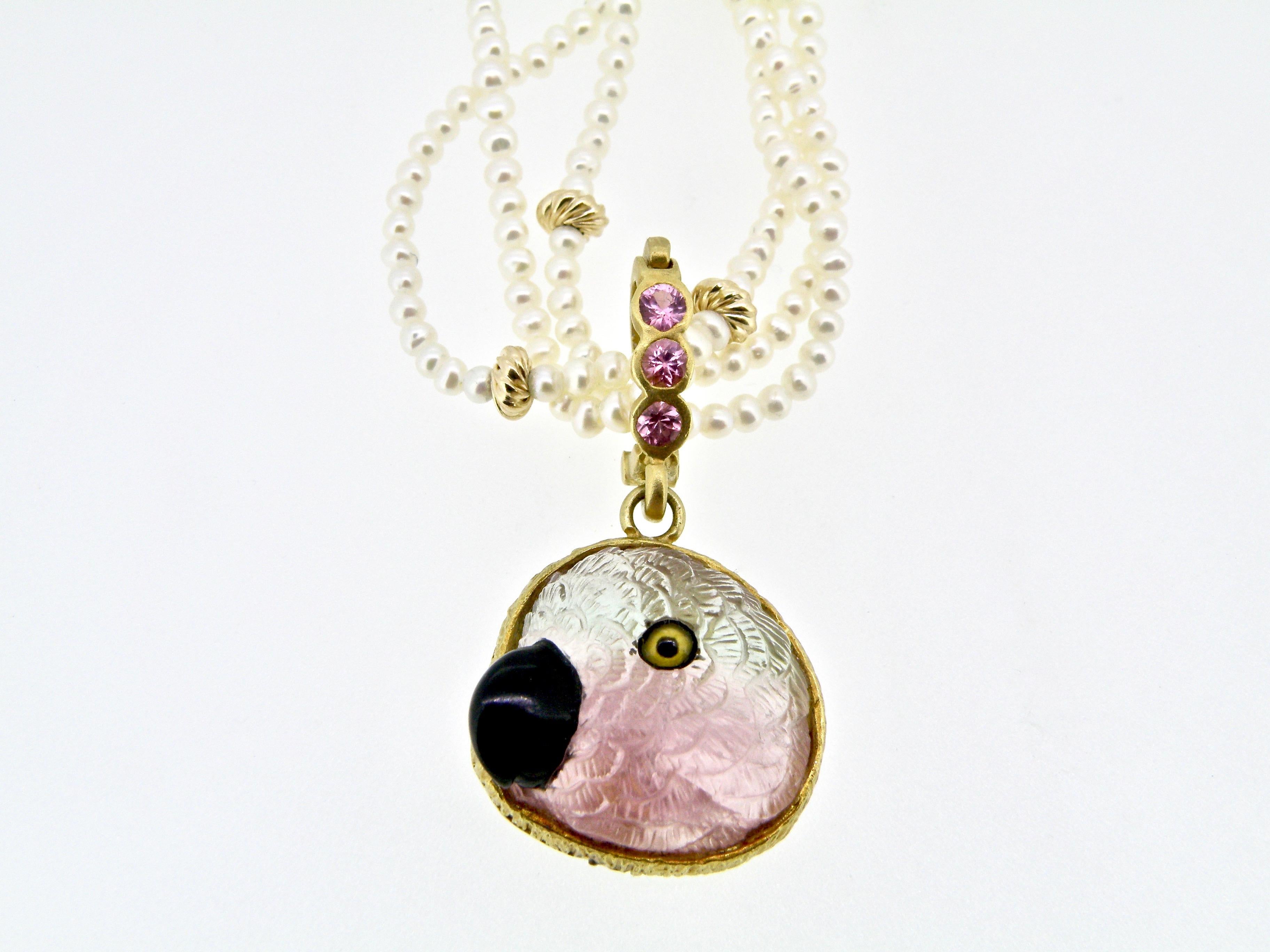 18K bicolored toumaline parrot pendant with onyx beakand citrine eyes ansd pink sapphire bail 
approx 0mm x 18mm
