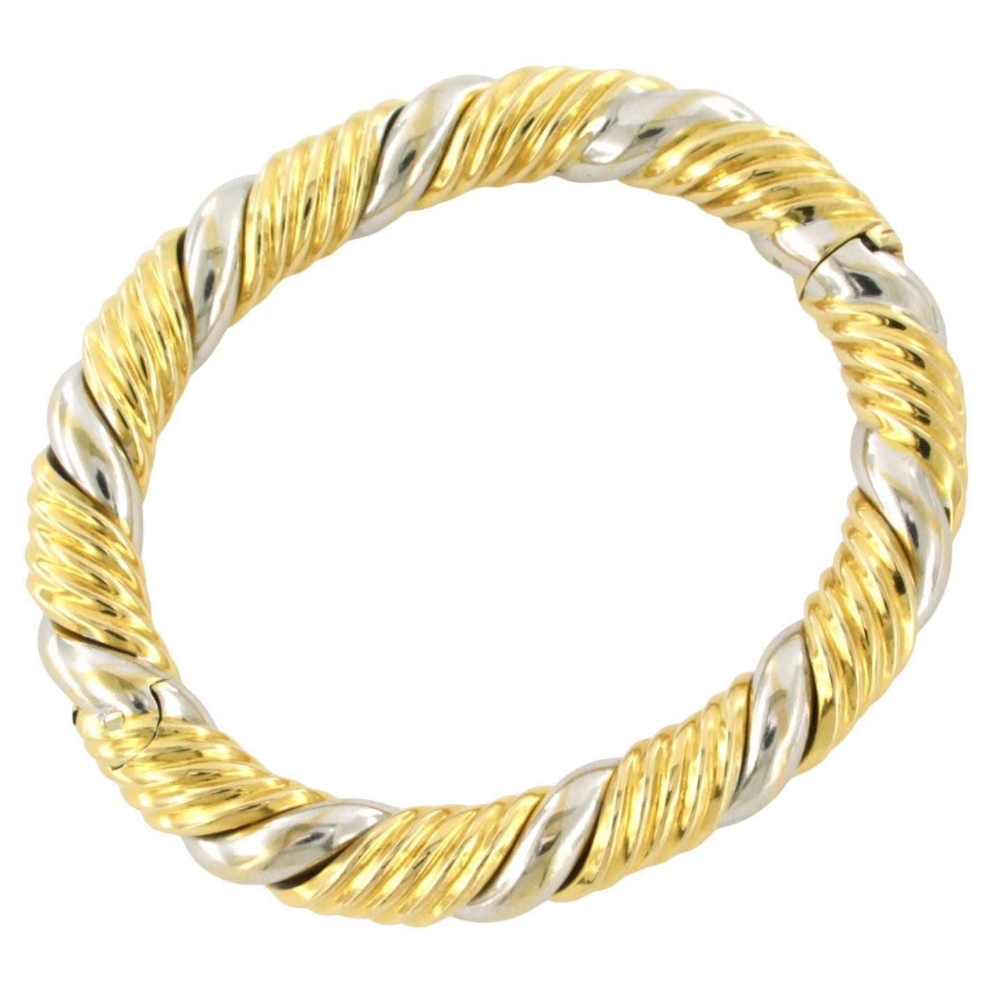 Bracciale in oro 18k bicolore - 61,3 grammi - dimensioni interne 5,8 cm x 5,0 cm