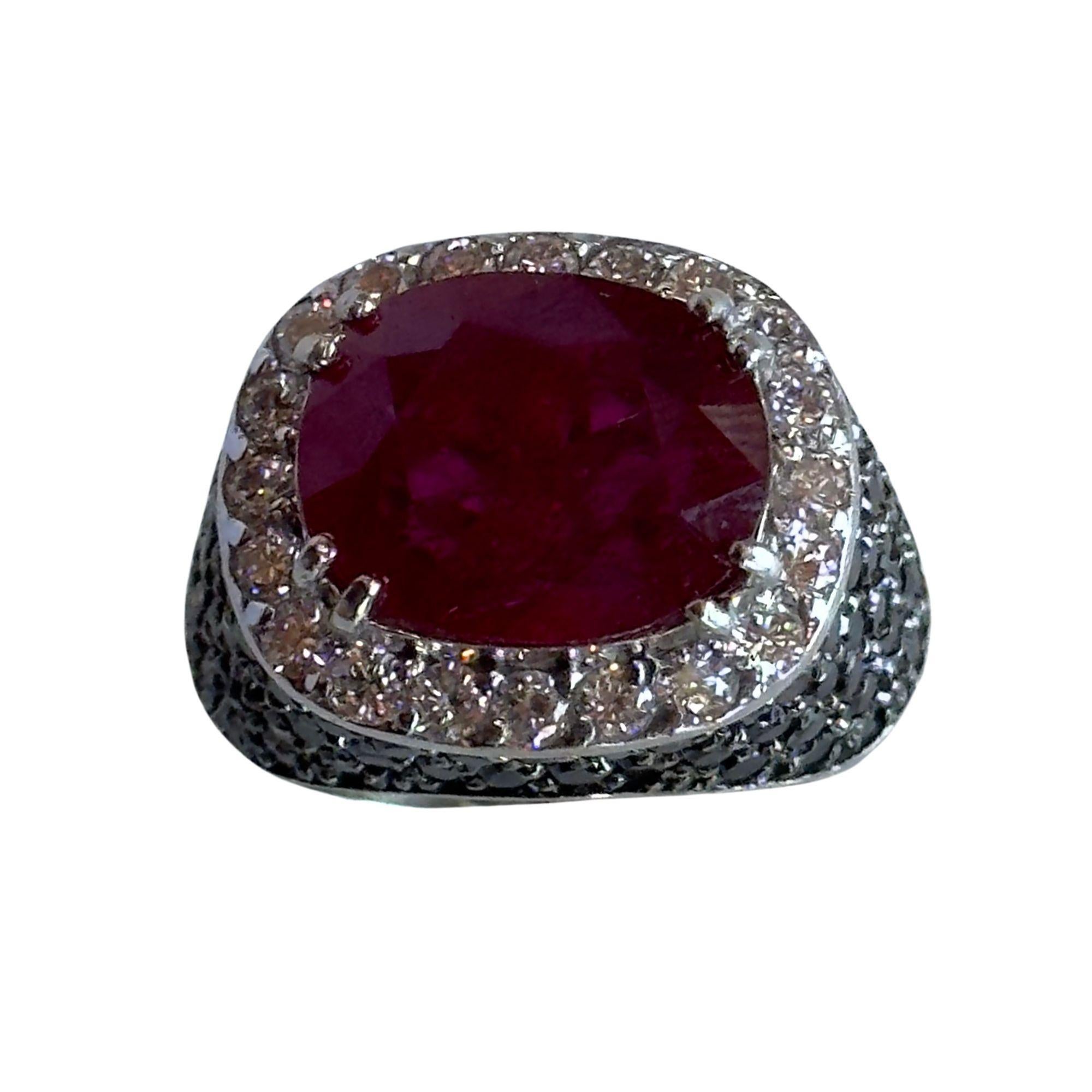 This 18k white gold ring boasts a stunning black diamonds weighing 3.50 carats, complemented by a 0.61 carats of white diamonds and a beautiful 5.11 carat ruby in the center. In good condition with minor surface wear, this ring is a timeless