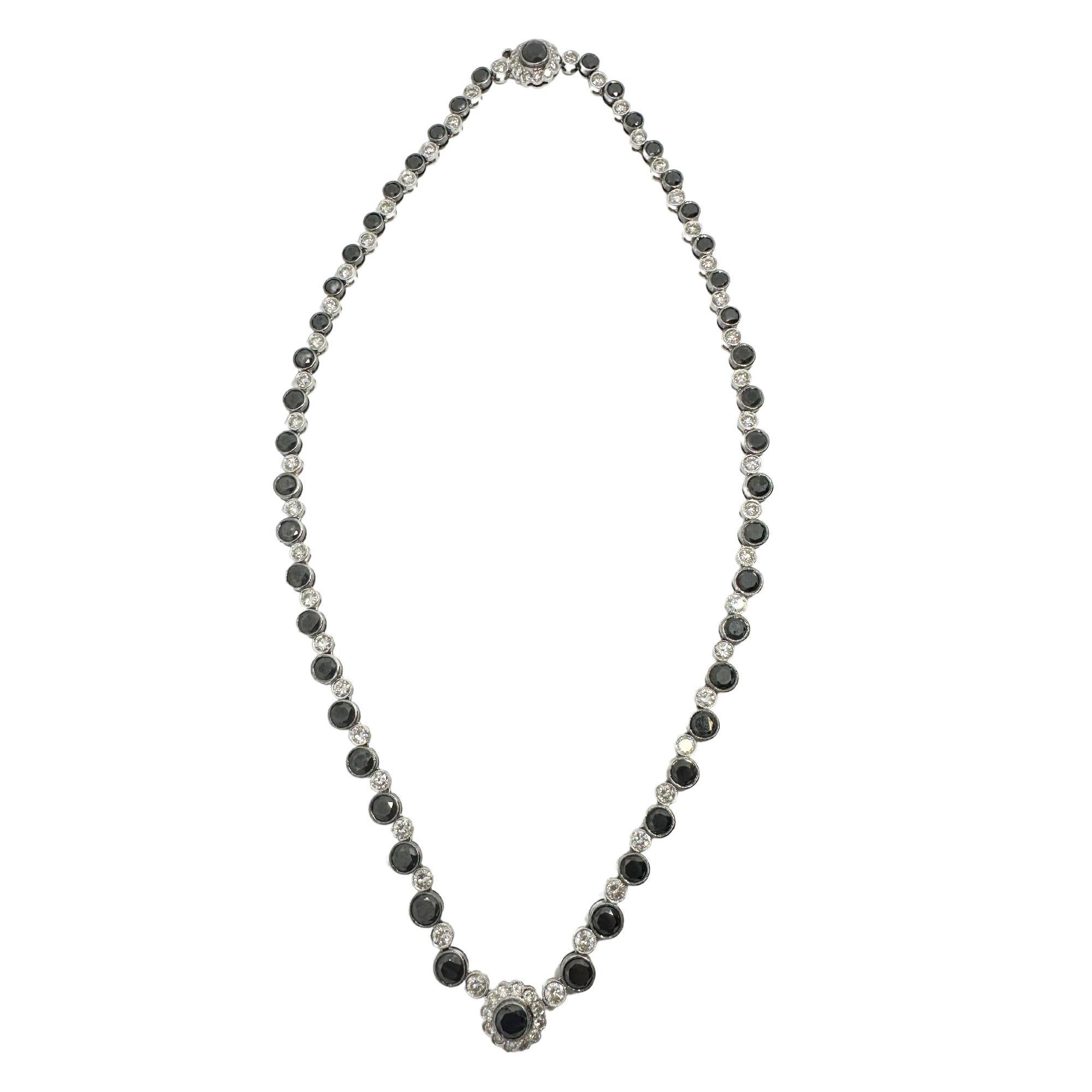 Look at our stunning 18k Black and White Diamond Necklace! Made of 18k White Gold and adorned with 21.56 carats of dazzling black and white diamonds, this necklace exudes elegance and style. With a length of 16 inches and weighing 27.5 grams, it's