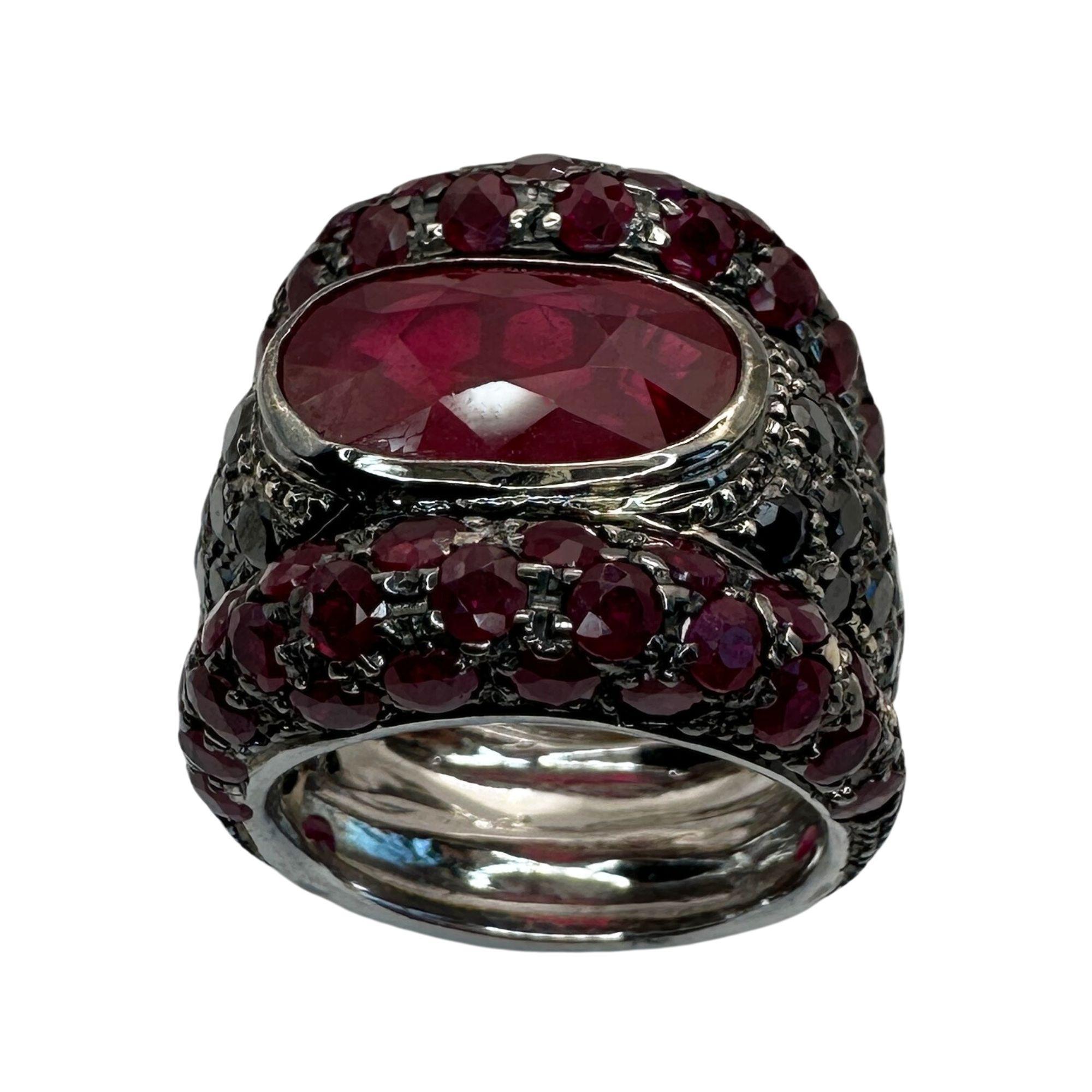 Indulge in ultimate luxury with our exquisite 18k Black Diamond, African Ruby, and Ruby Ring. Crafted from 18k white gold and weighing 18.1 grams, this ring boasts 3.05 carats of black diamonds, 7.16 carats of African ruby, and 7.29 carats of ruby