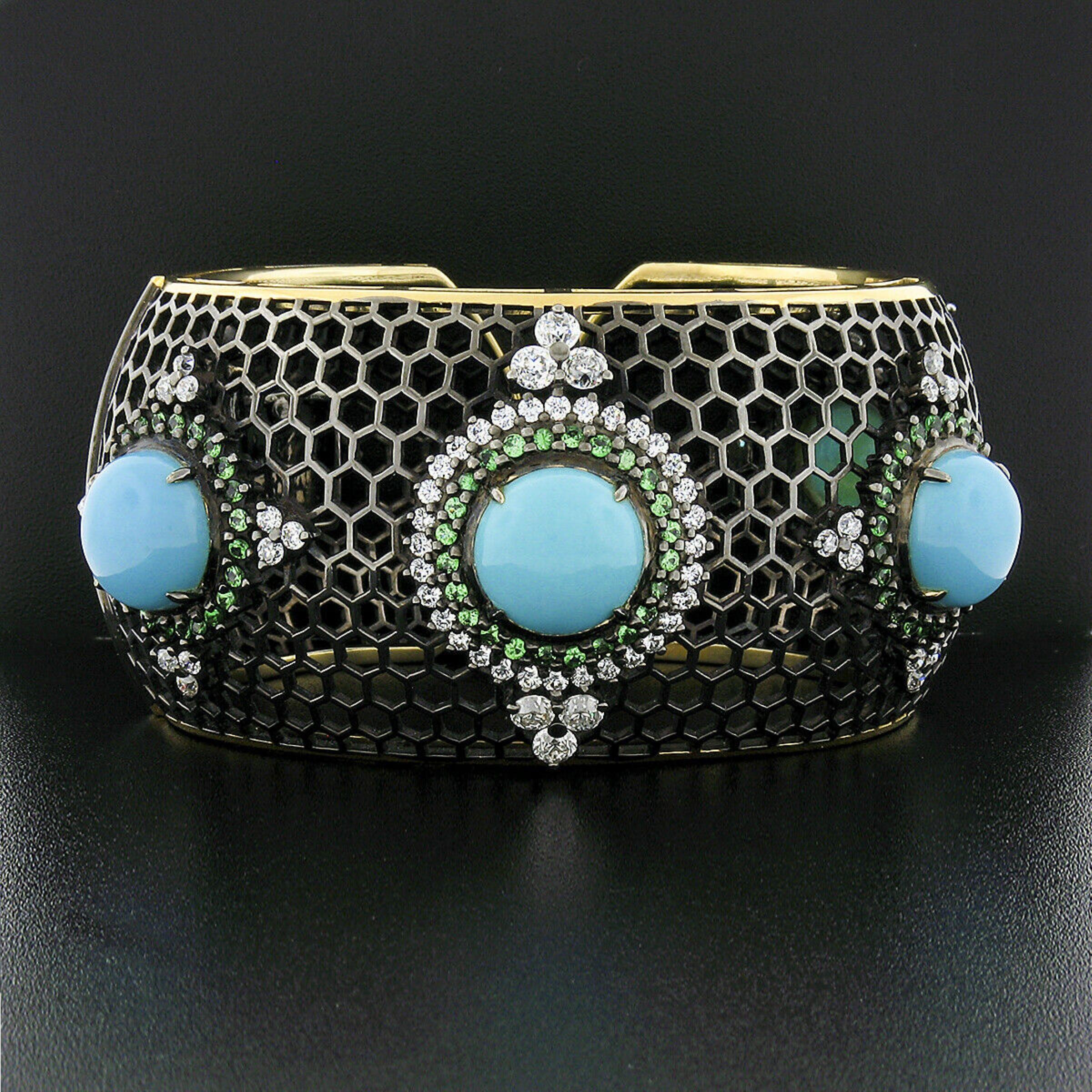 Here we have a very unique, wide open cuff bracelet crafted in solid 18k yellow gold with almost the entire piece being dipped in black rhodium except for the sides. The wide bracelet has an open honeycomb design featuring five turquoise stations