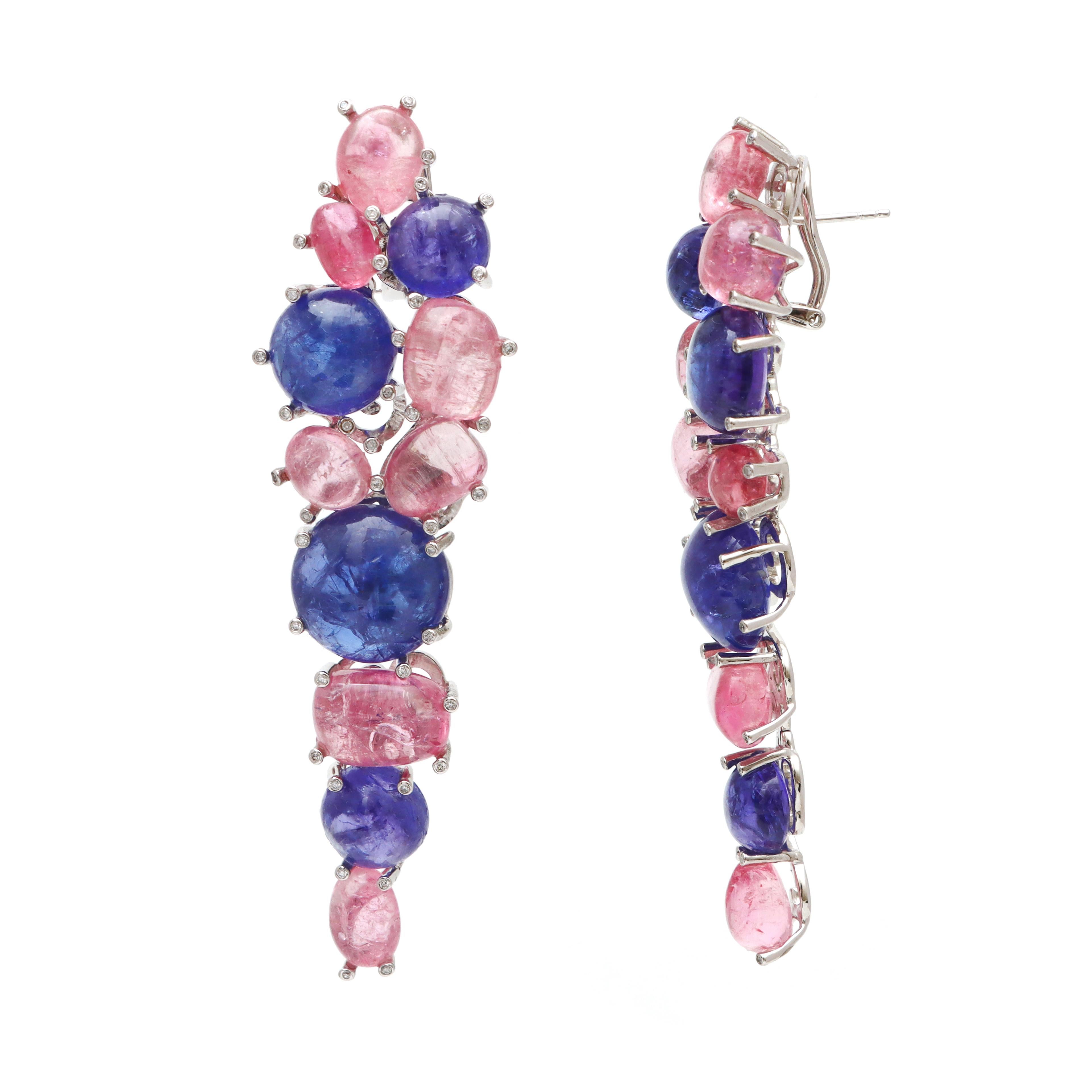 Gorgeous pair of earrings realized in 18kt white gold structure, with Tourmaline And Tanzanite 

ITEM CODE - NFJSD 1739

METAL PURITY - 18K

GEMSTONE - Tourmaline And Tanzanite 

TOTAL GEMSTONE WEIGHT - 124.40 CTS 

TOTAL DIAMOND WEIGHT - 0.35