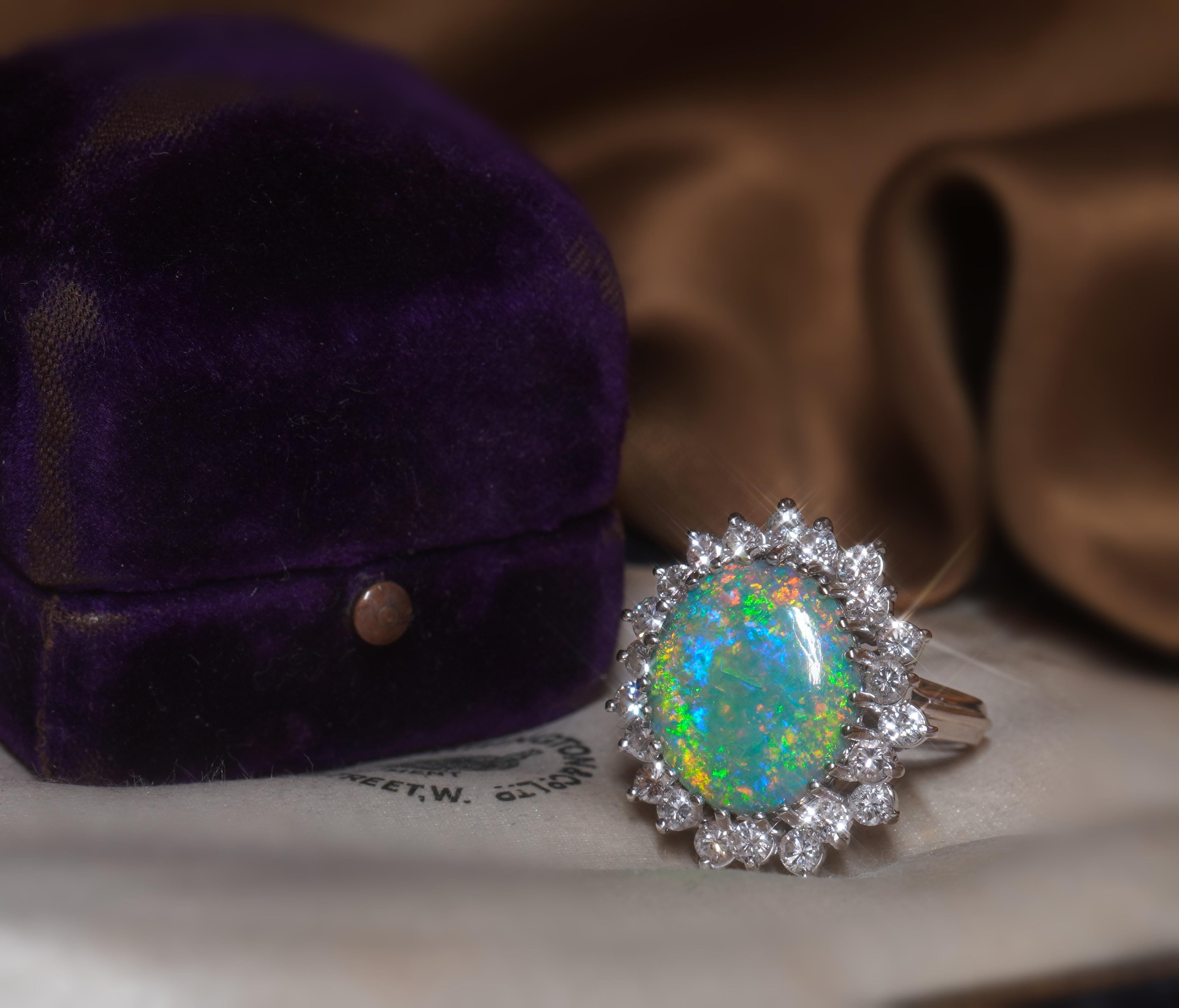 Old South Jewels proudly presents...LUXURY.   RARE GIA CERTIFIED SOLID AUSTRALIAN BLACK OPAL & DIAMOND VINTAGE 18K RING!   FINE EARTH-MINED HUGE 7.08 CARAT AUSTRALIAN SOLID OPAL, WITH LOTS OF GORGEOUS BRIGHT FIRE.    CROWNED WITH 1.32 CARATS