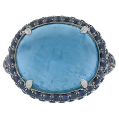 Anillo de oro ennegrecido de 18 quilates con zafiro pavé y aguamarina ojo de gato rara de 15 quilates GIA