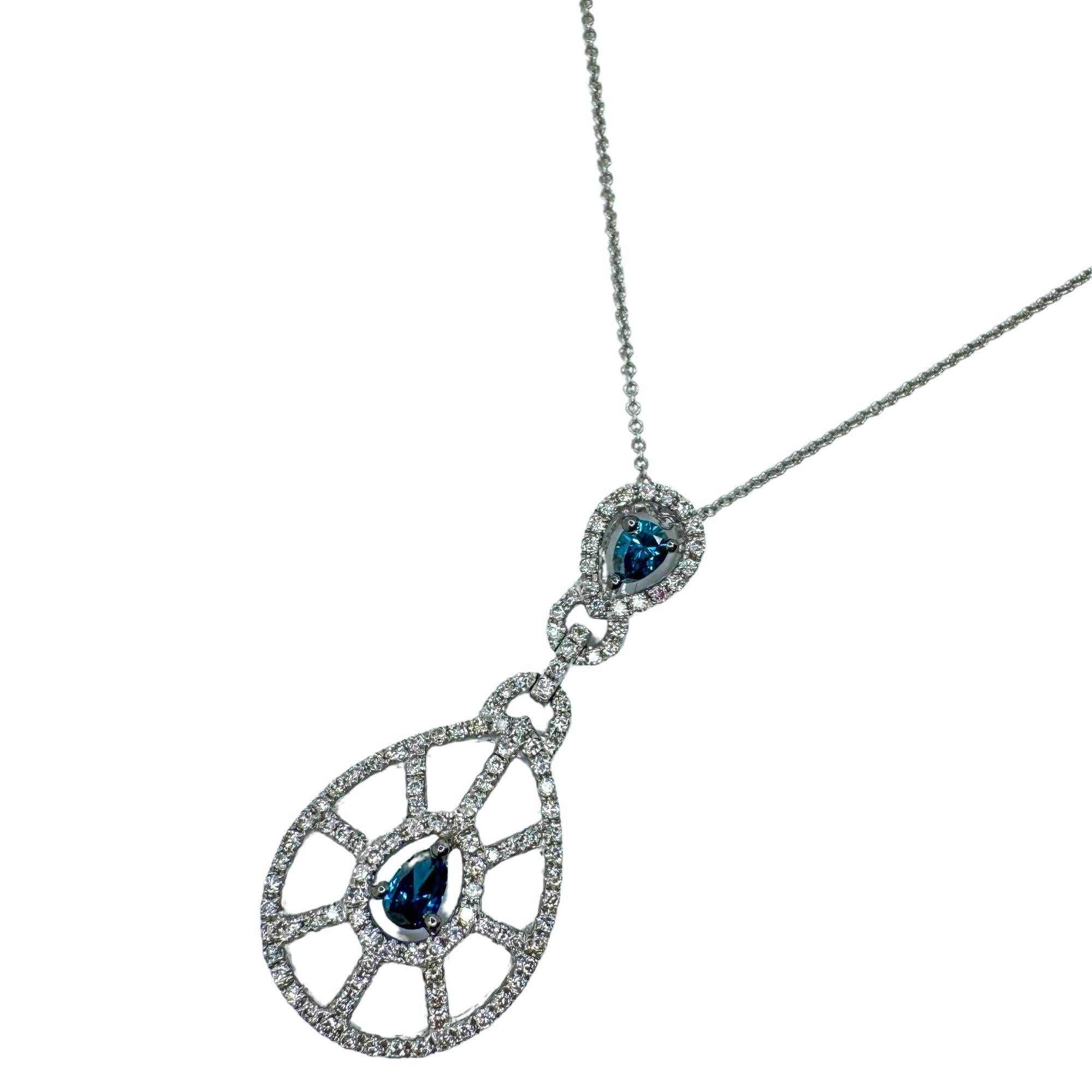 Indulge with our 18k Blue and White Diamond Pendant Necklace! With a 16 inch chain and 1.40 inch pendant, this piece is crafted from 18k white gold and adorned with 0.44 carats of sparkling white diamonds and 0.28 carats of stunning blue diamonds.