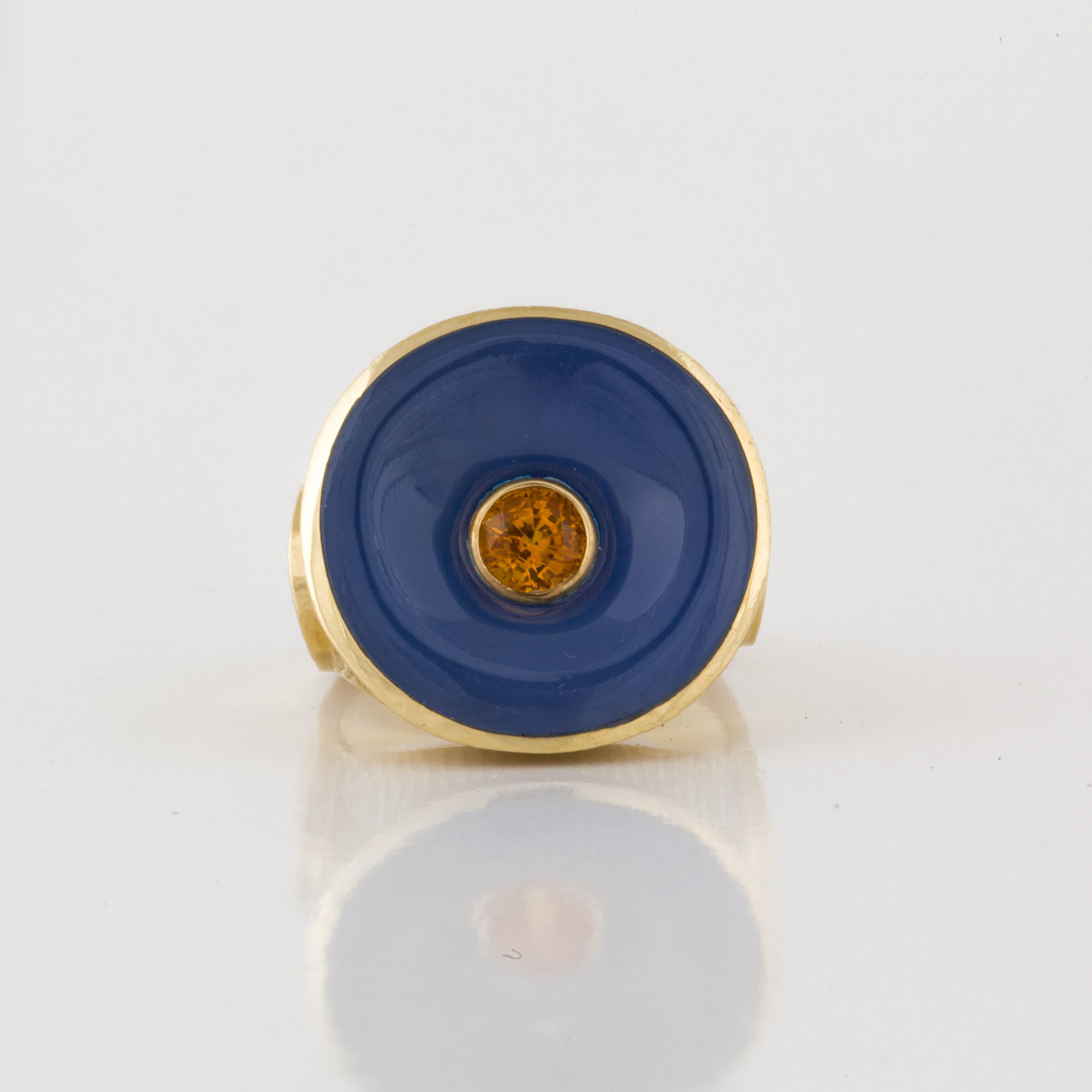 18K yellow gold ring featuring a funnel-shaped blue chalcedony stone with a faceted citrine in the center.  The shank is squared off at the back and has both smooth and florentine finishes.  Measures 7/8 of an inch across the top.  Ring is a size 7.