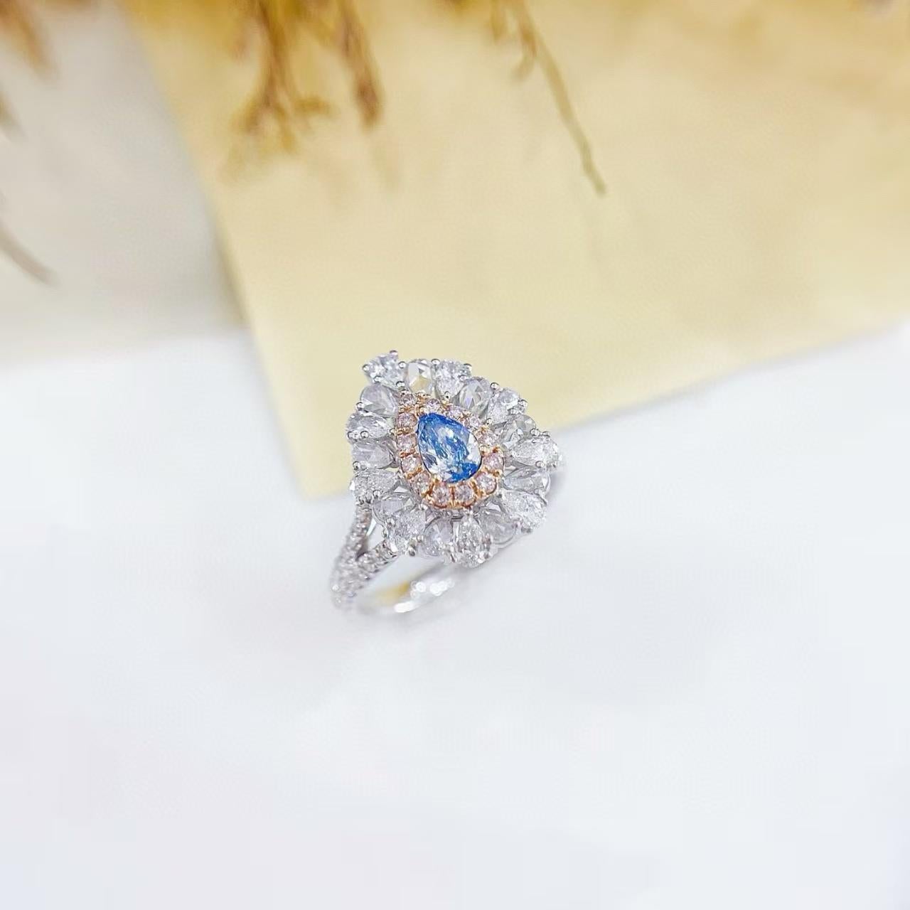 18K Vivid Blue Diamond Pink Diamond Double Halo Cocktail Ring/Pendant 

Main Stone D - 0.32 CT
Side Stone D - 1.06 CT
Total Weight - 4.9 GM

Innovative Dual-purpose Design: This ring can be used as both a ring and a pendant, offering great