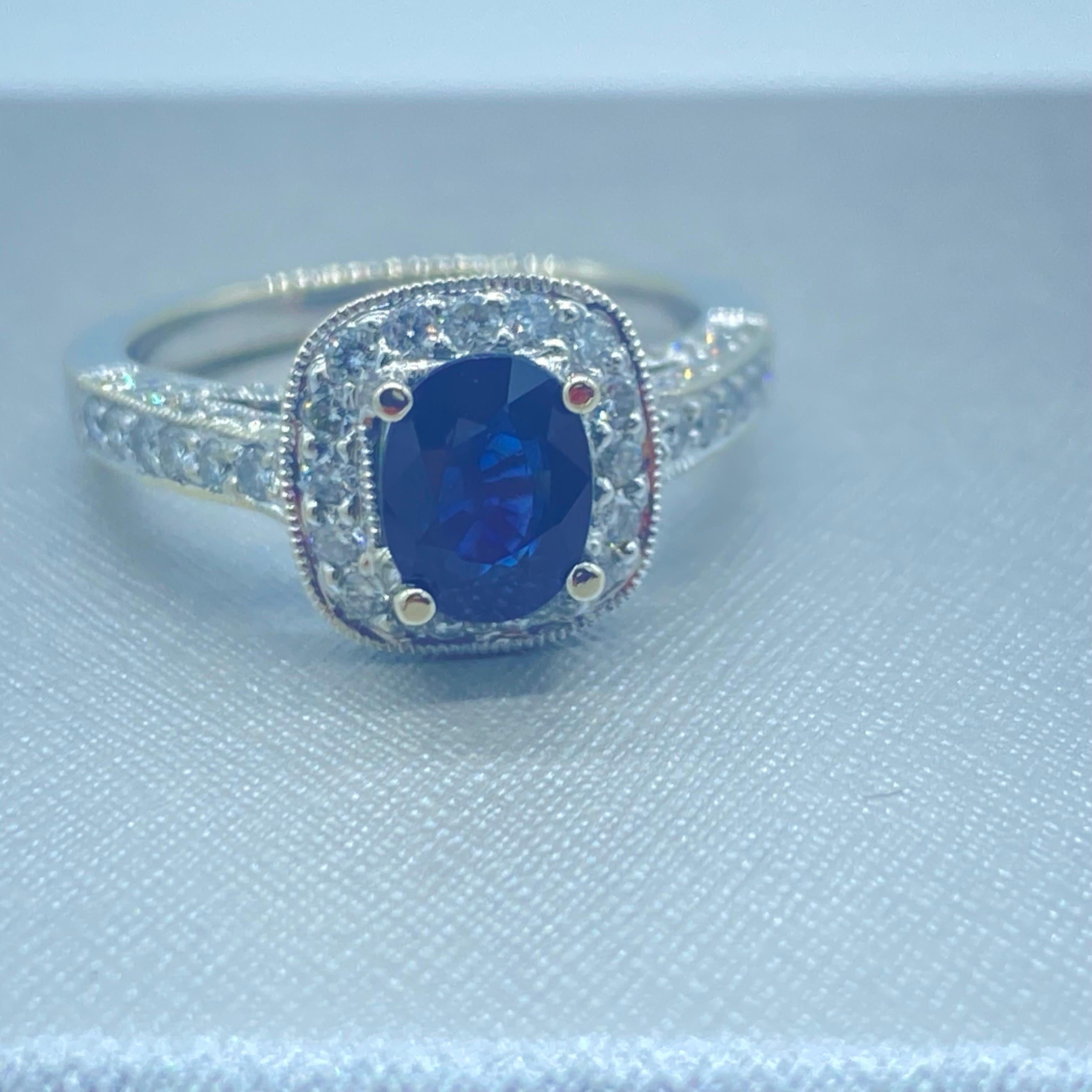 Contemporary 18K Blue Sapphire and Diamond Halo Ring 2.20 Carat Total For Sale