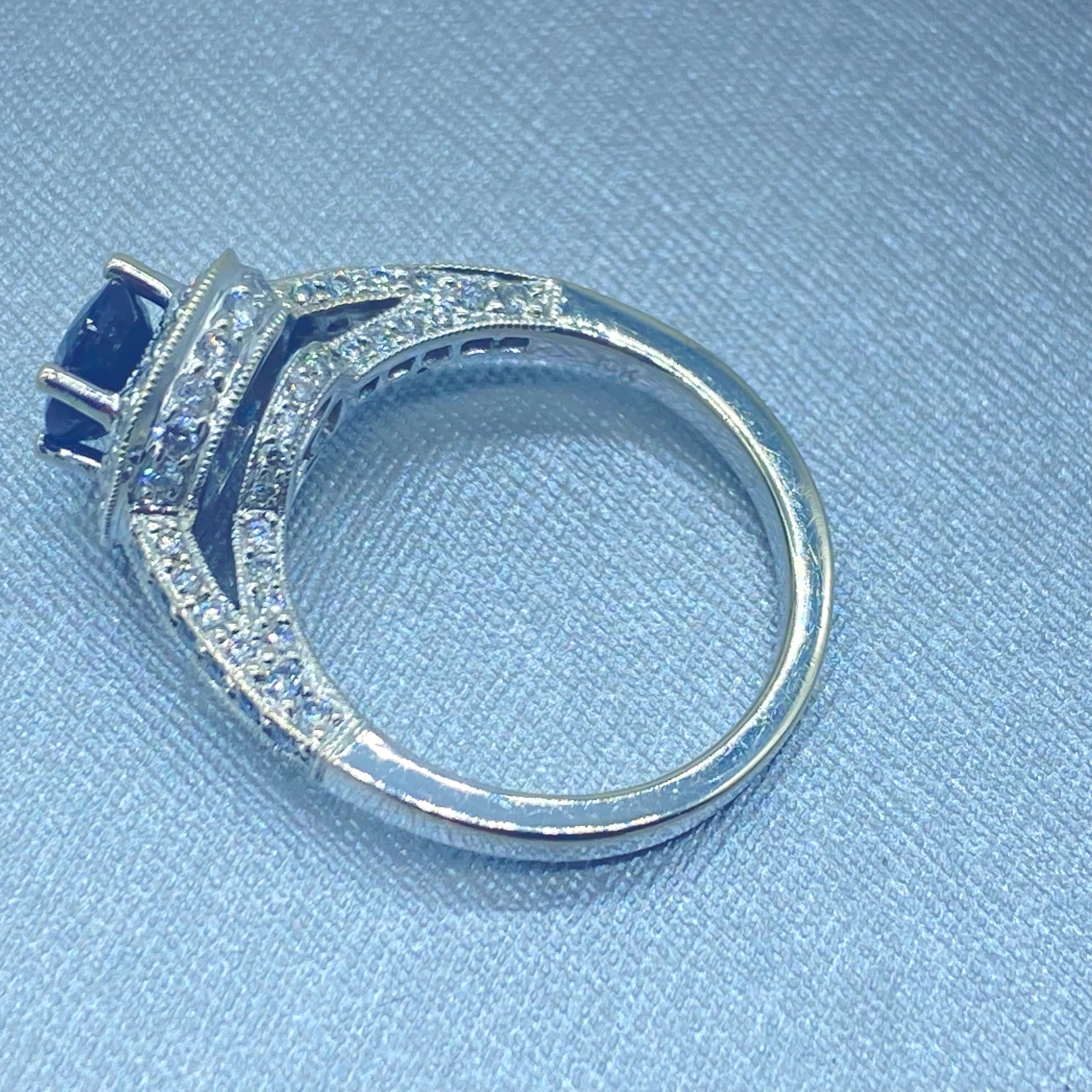 Oval Cut 18K Blue Sapphire and Diamond Halo Ring 2.20 Carat Total For Sale