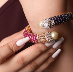 Armband aus 18 Karat Blauem Saphir und Rubinen