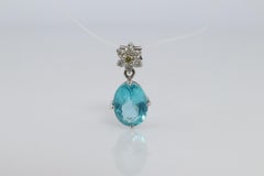 18k Blue TOPAZ Pendant. High quality solitaire oval pendant with Daisy Diamonds.
