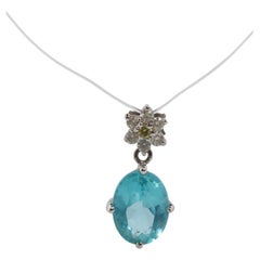 18k Blue TOPAZ Pendant. High quality solitaire oval pendant with Daisy Diamonds.