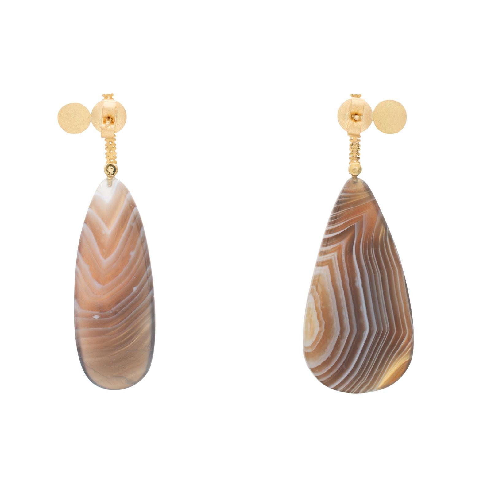 White Diamonds set in 18 carat recycled gold with Botswana Agate in opposing shapes designed by Cresta Bledsoe. Gemstones are ethically sourced and non-heat treated. All of the pieces are one-of-a-kind and handmade by a single artisan in the USA